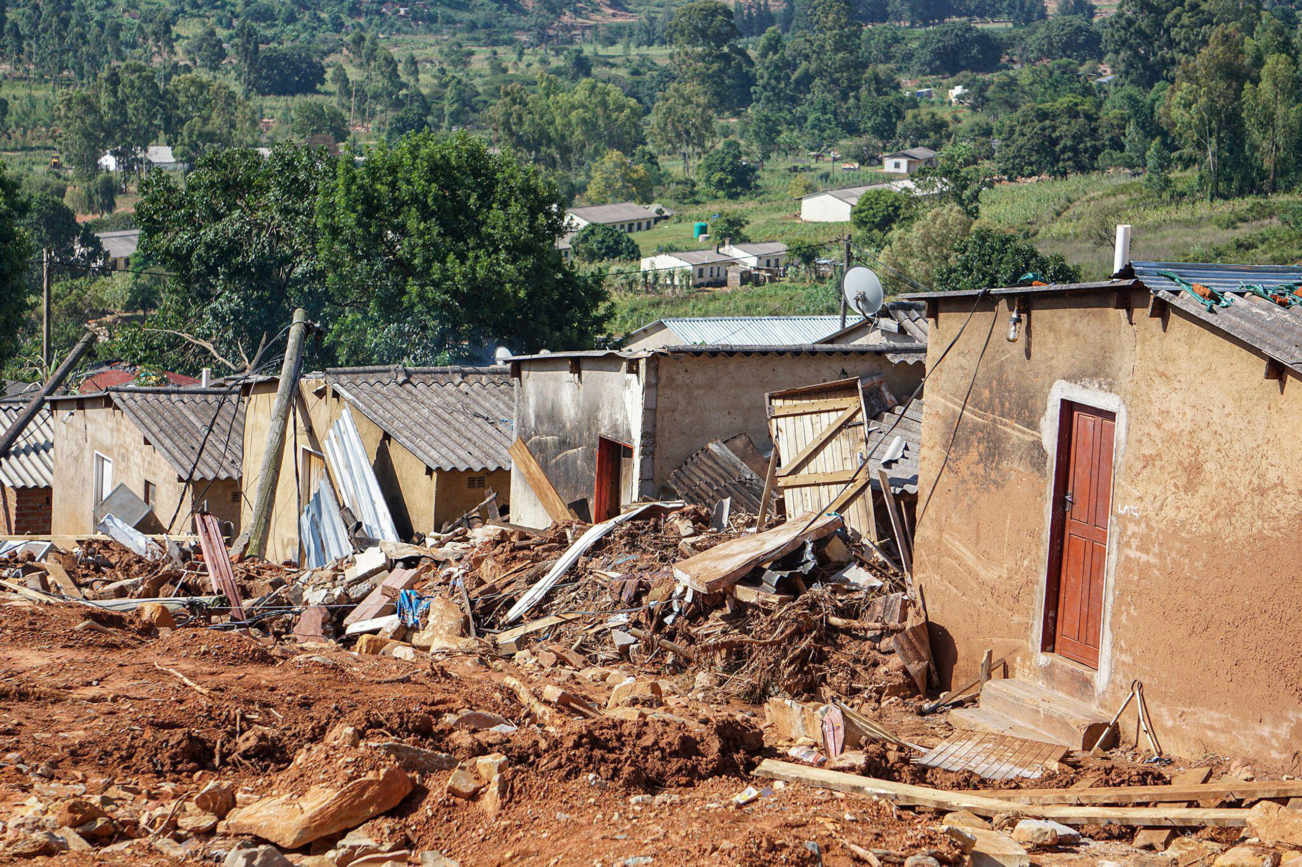 damaged houses in deep mud