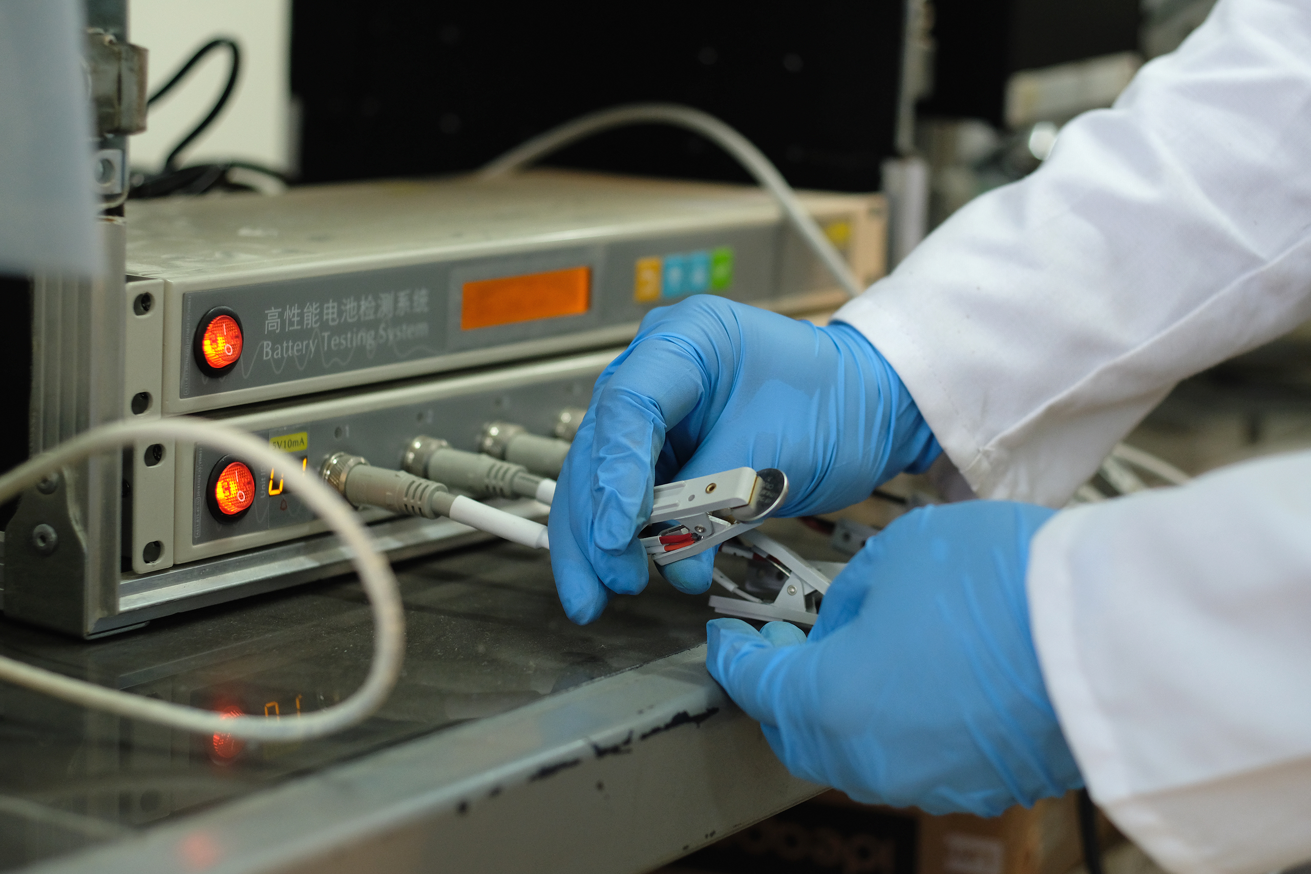 button battery being assembled 