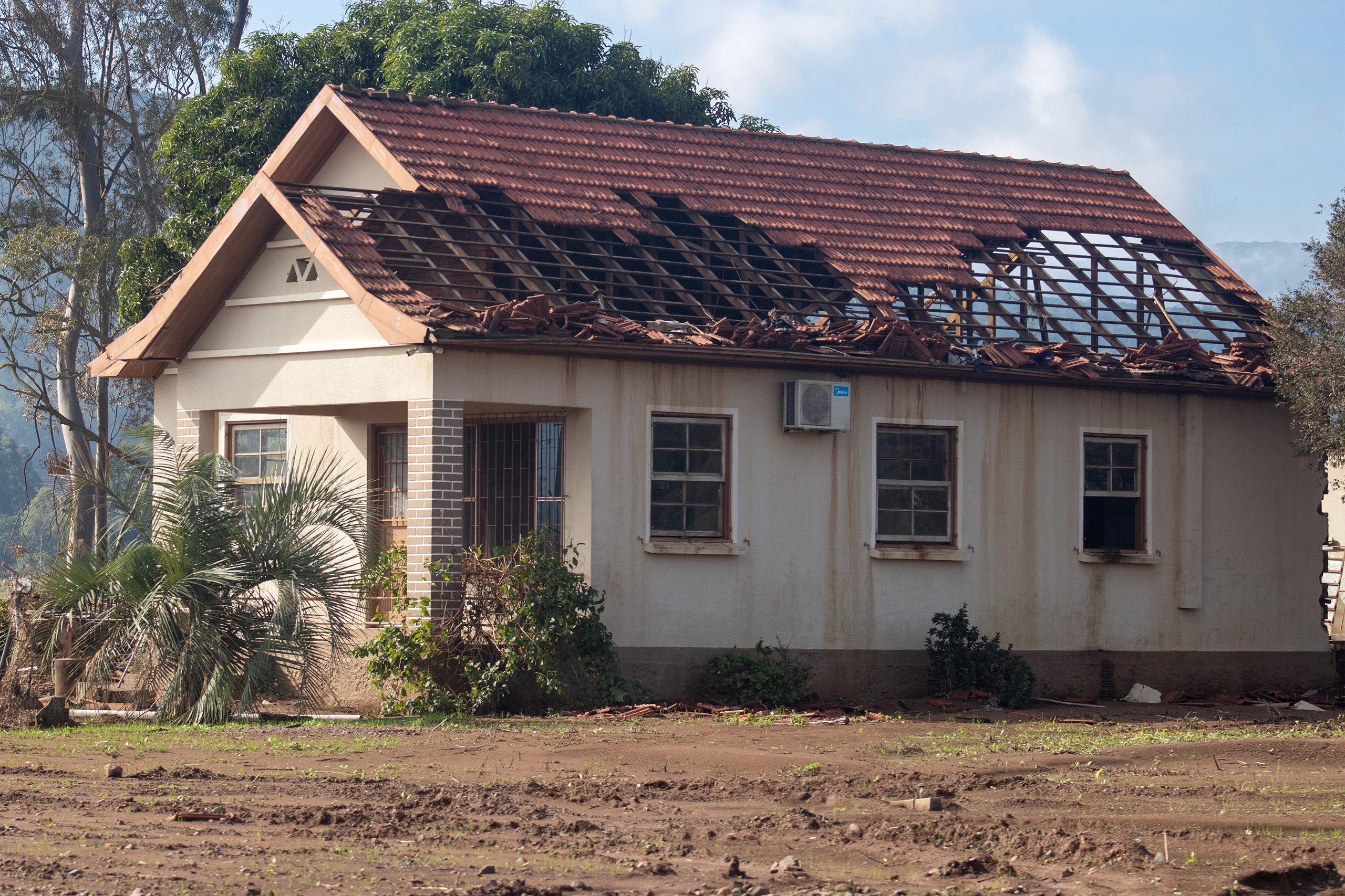 house with damaged roof