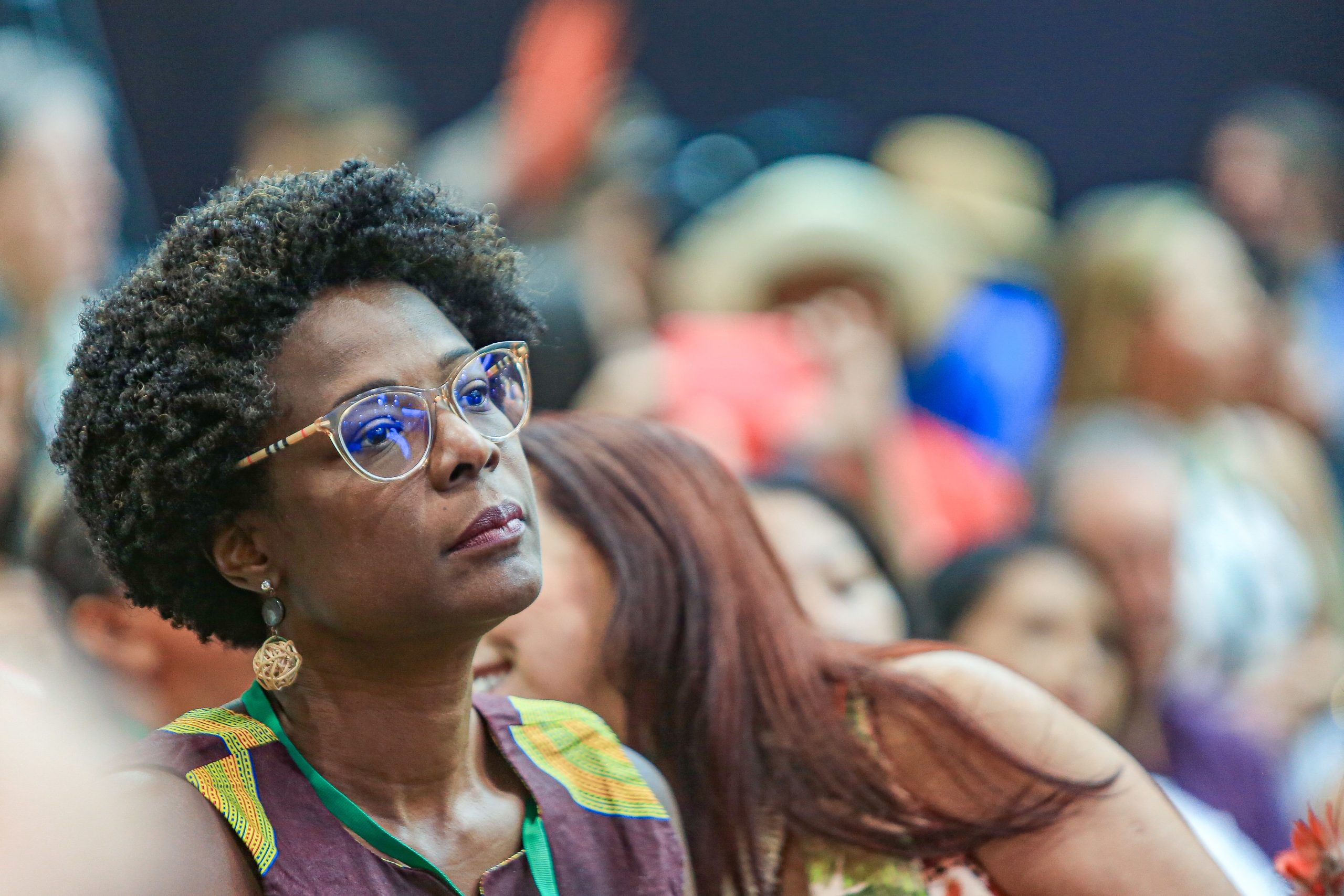 focused woman in crowd