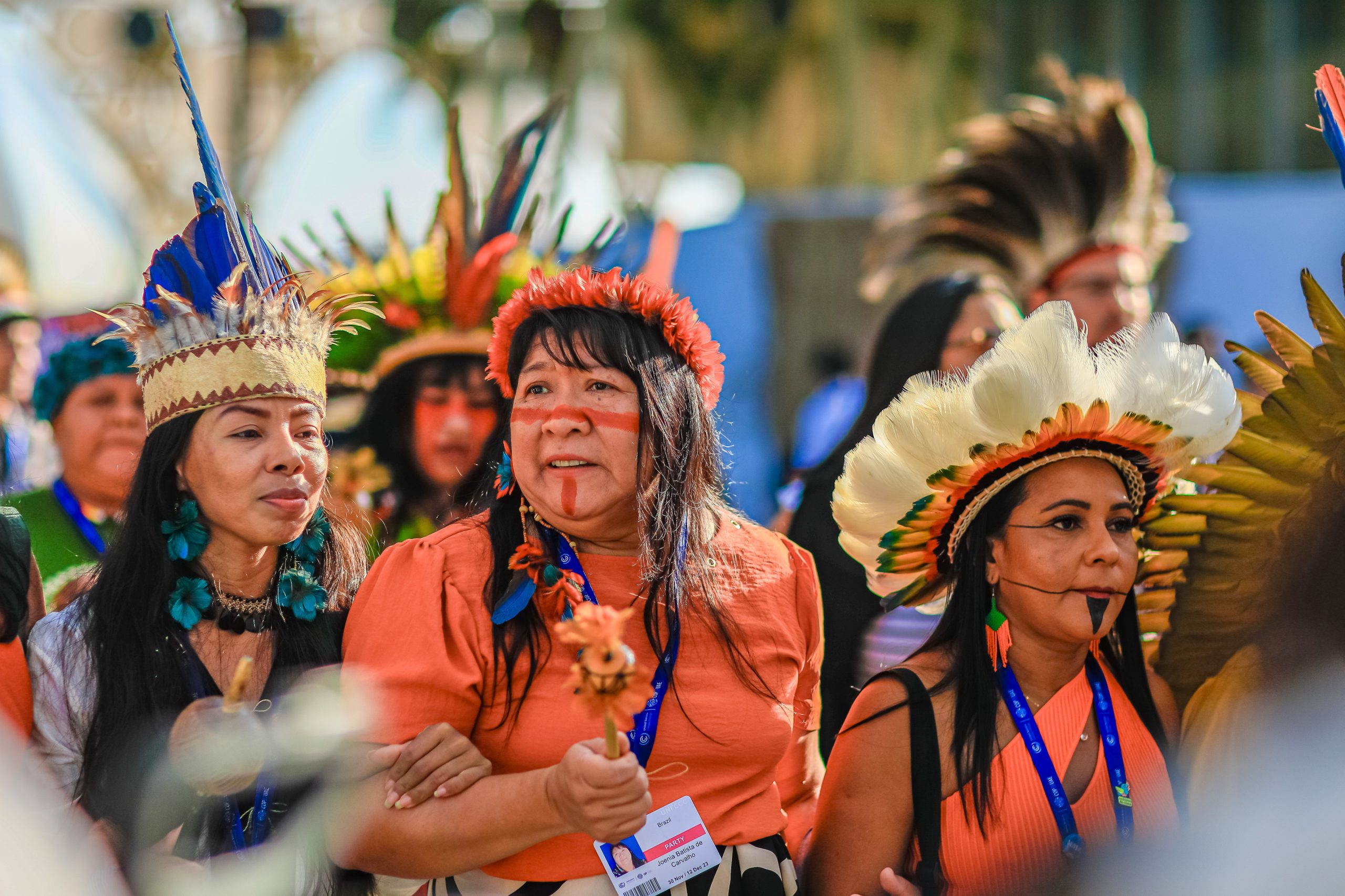 Indigenous people wearing colourful outfits