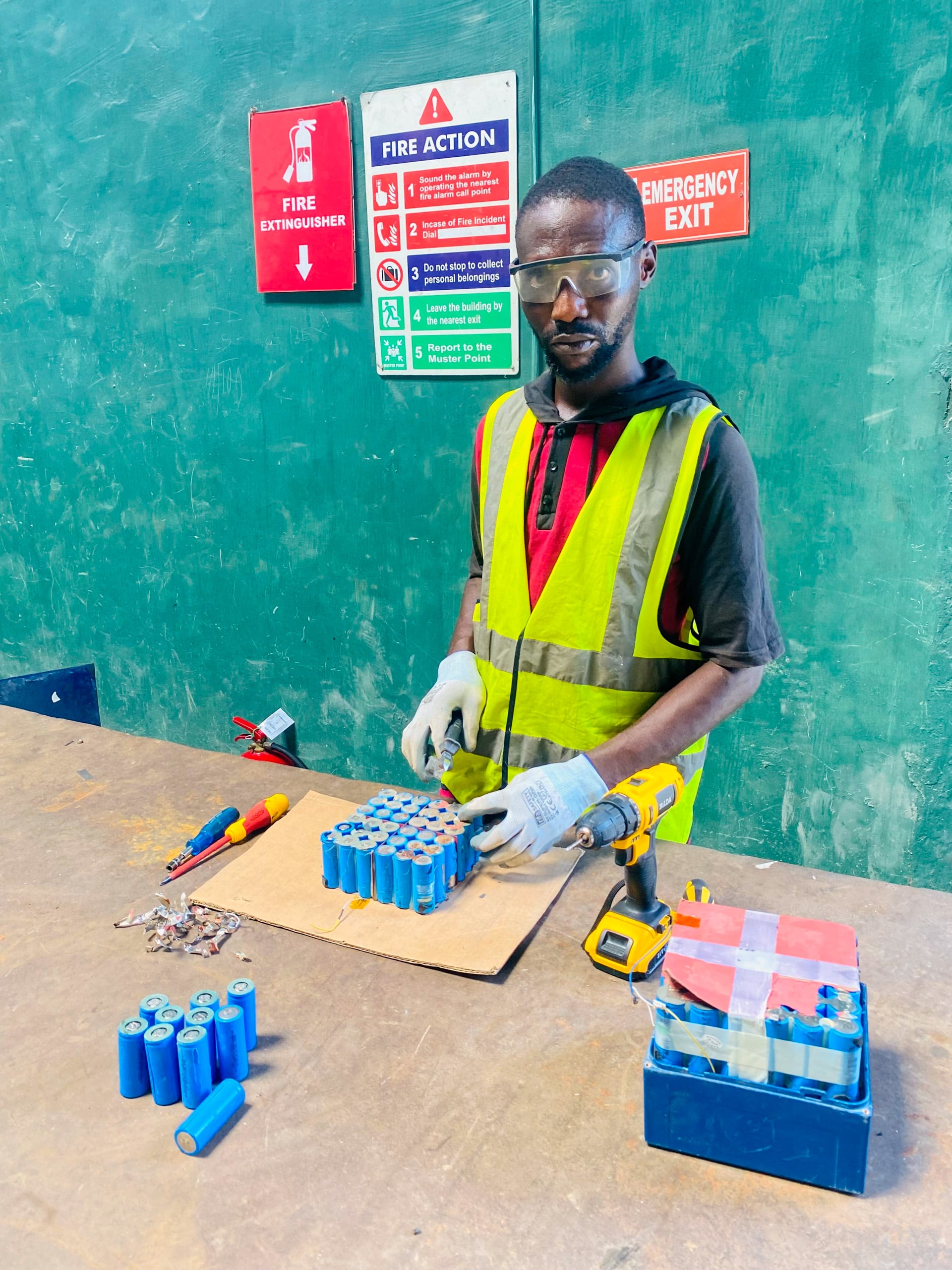man handling battery cells