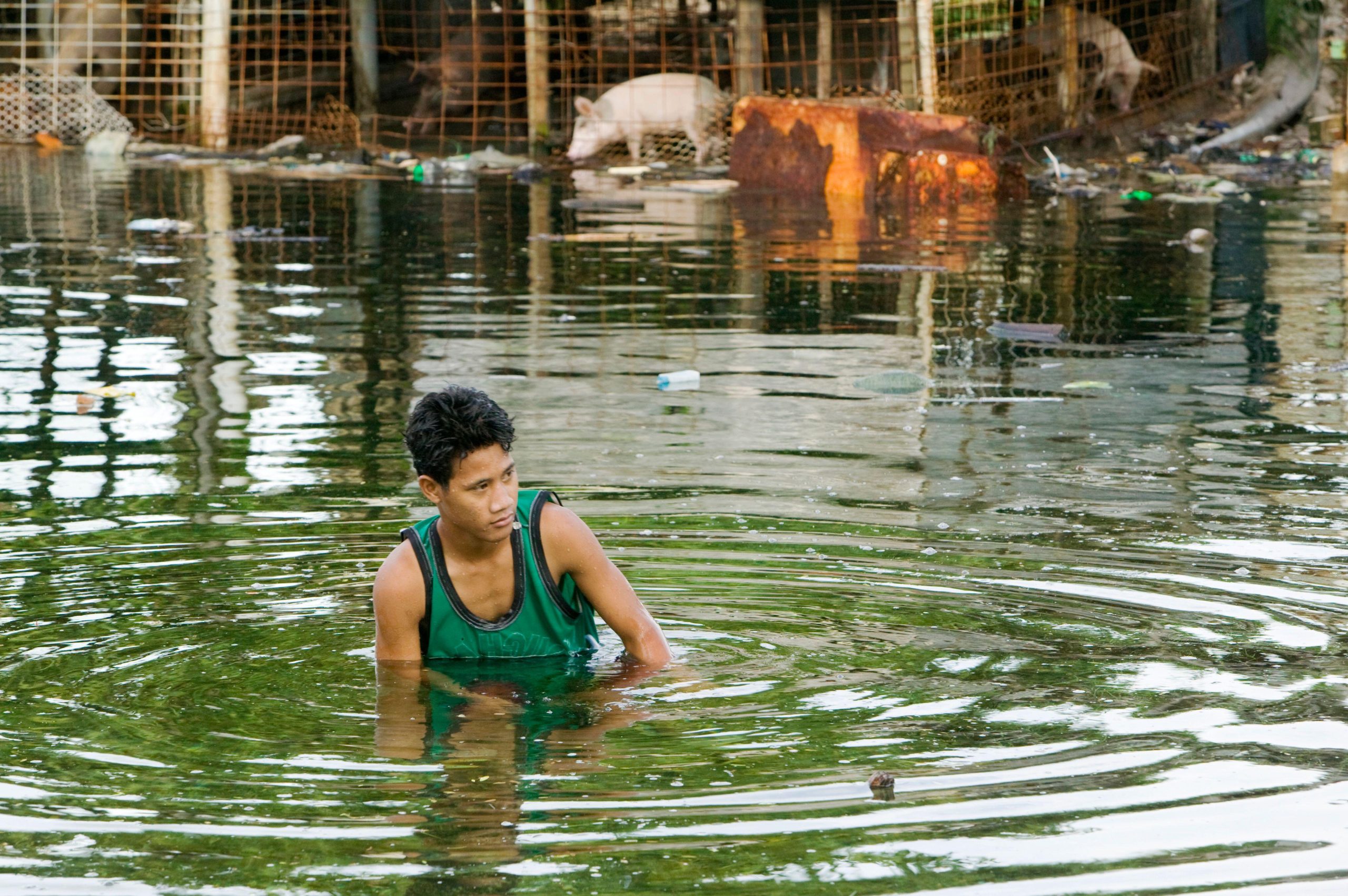 man in flood water
