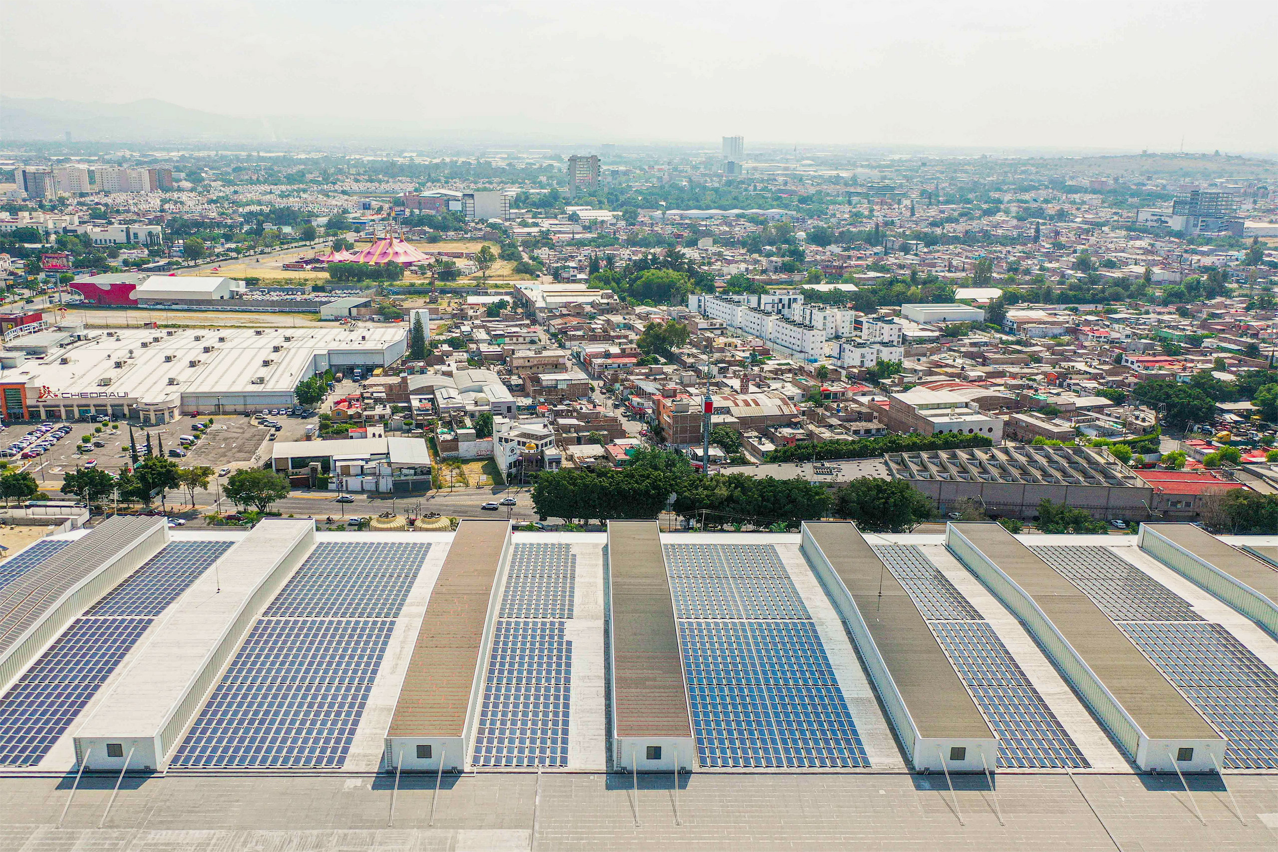 solar panels on roof, view of city in the background