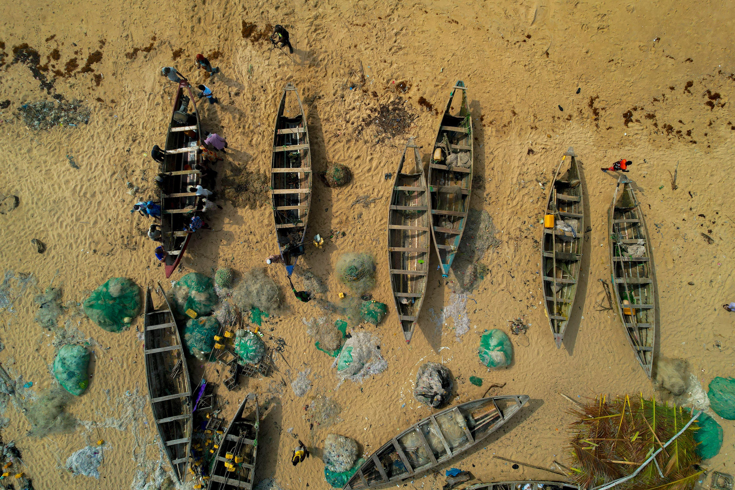 Aerial view of fishing boats on a sandy beach