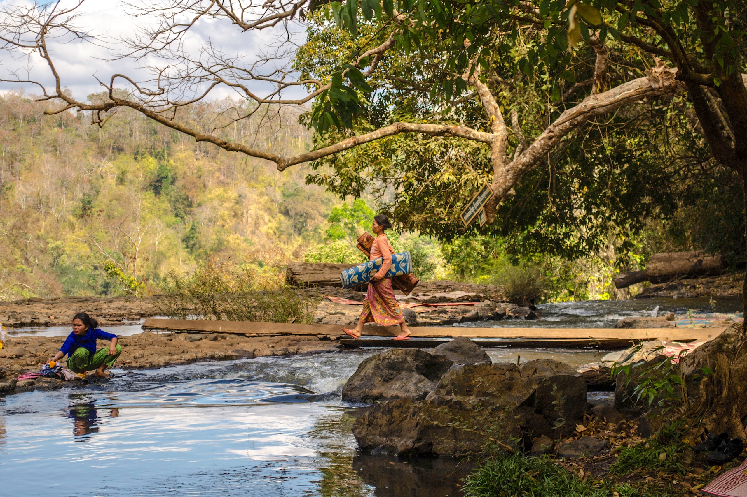 <p>An Indigenous woman washing clothes at Bou Sra Waterfall in Mondulkiri, Cambodia. Local communities are concerned about the potential impact of six new wind farms approved in the region (Image: Brian Atkinson / Alamy)</p>