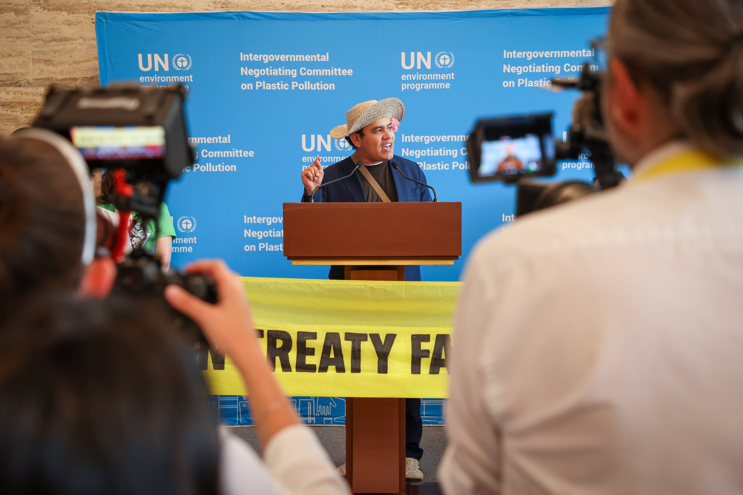 A man delivering a speech at a podium