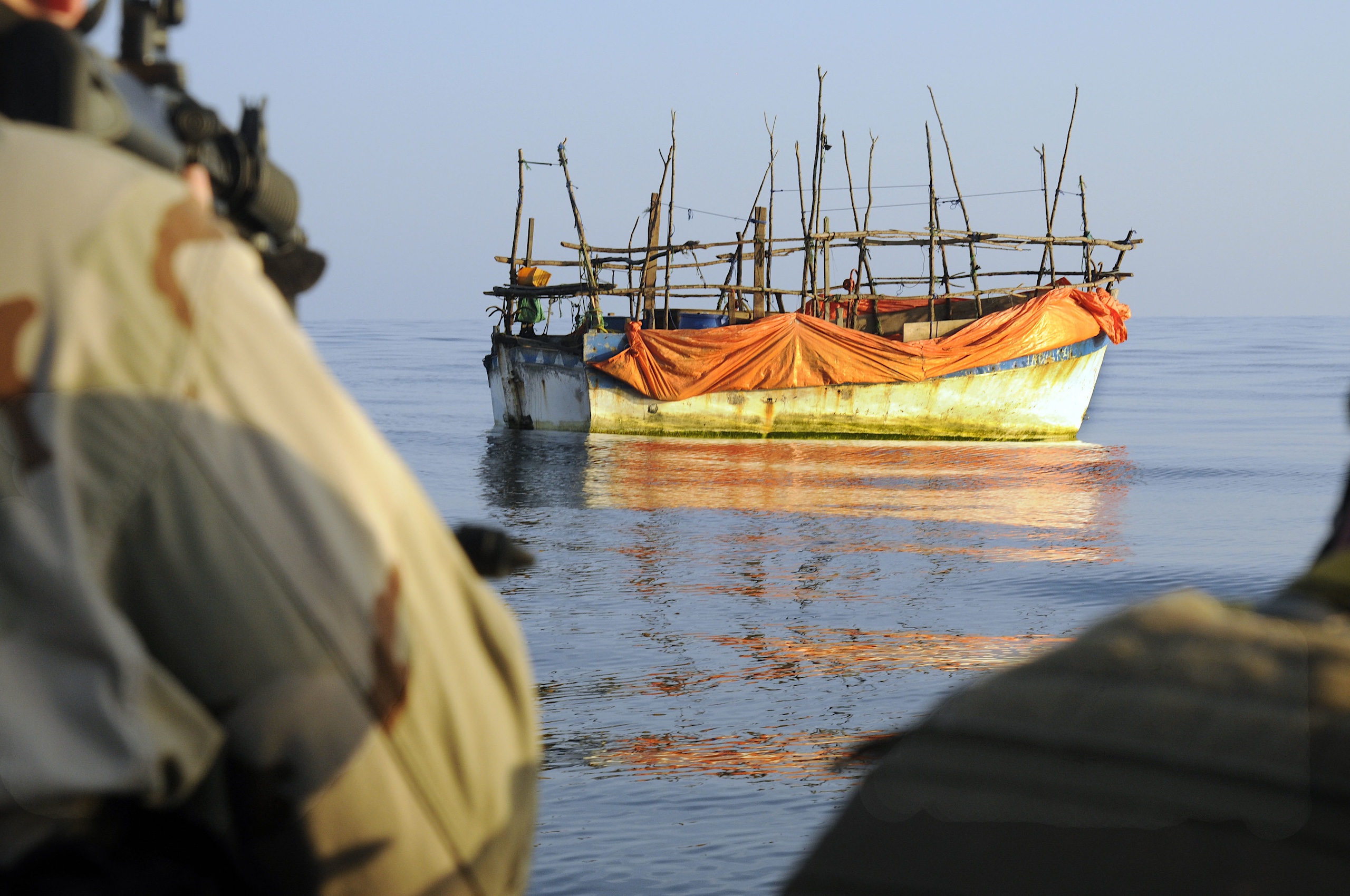 <p>A counter-piracy task force approaches a boat in the Gulf of Aden, off the coast of Somalia. Worldwide, fishers are increasingly becoming the victims of pirates but are often absent from mainstream security discussions on the issue (Image: <a href="https://www.flickr.com/photos/national_museum_of_the_us_navy/23726853441/">Daniel Edgington</a> / <a href="https://www.flickr.com/photos/national_museum_of_the_us_navy/">National Museum of the U.S. Navy</a>, <a href="https://creativecommons.org/publicdomain/mark/1.0/deed.en">PDM 1.0</a>)</p>