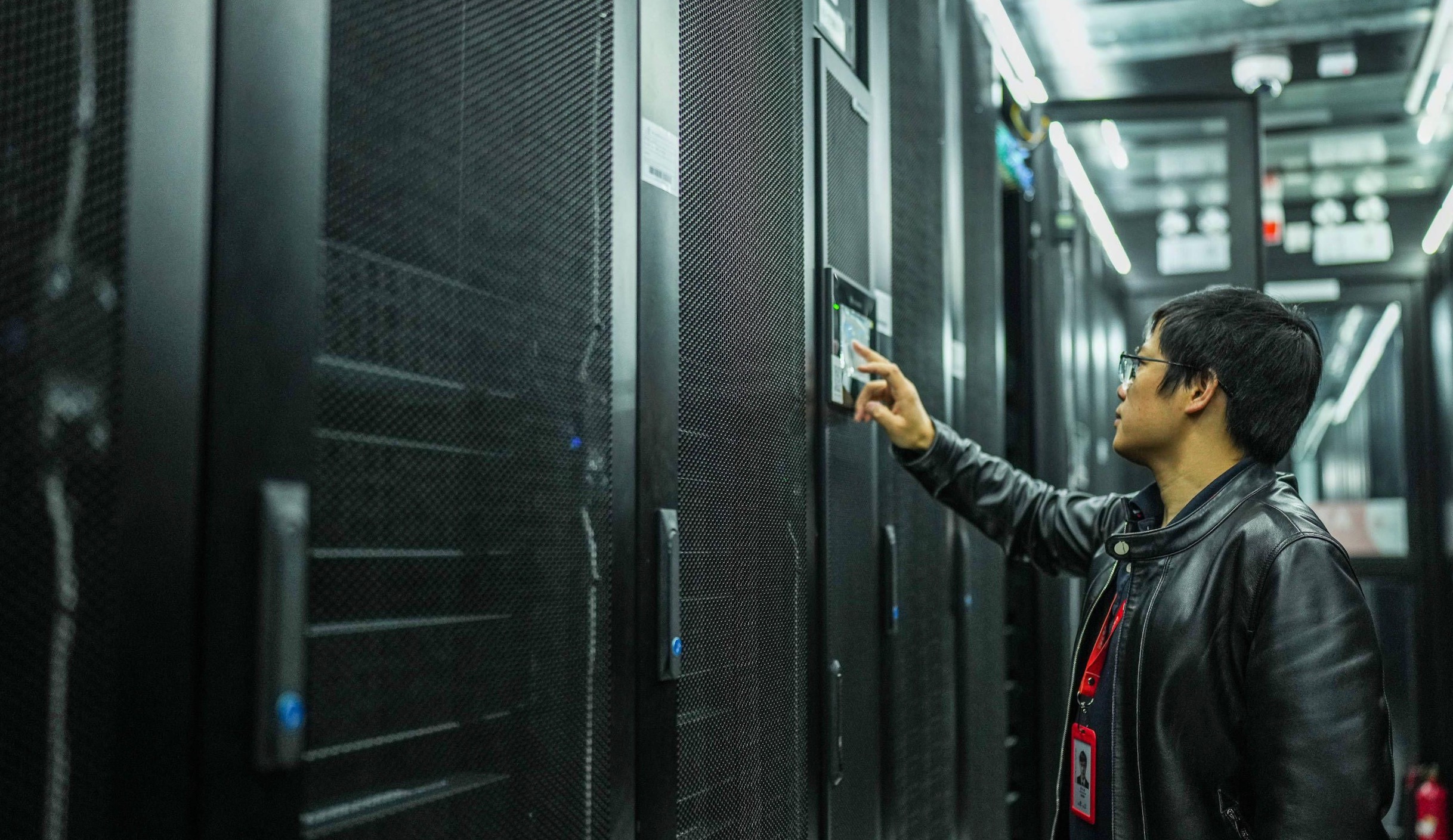 A staff inspects facilities in a data center