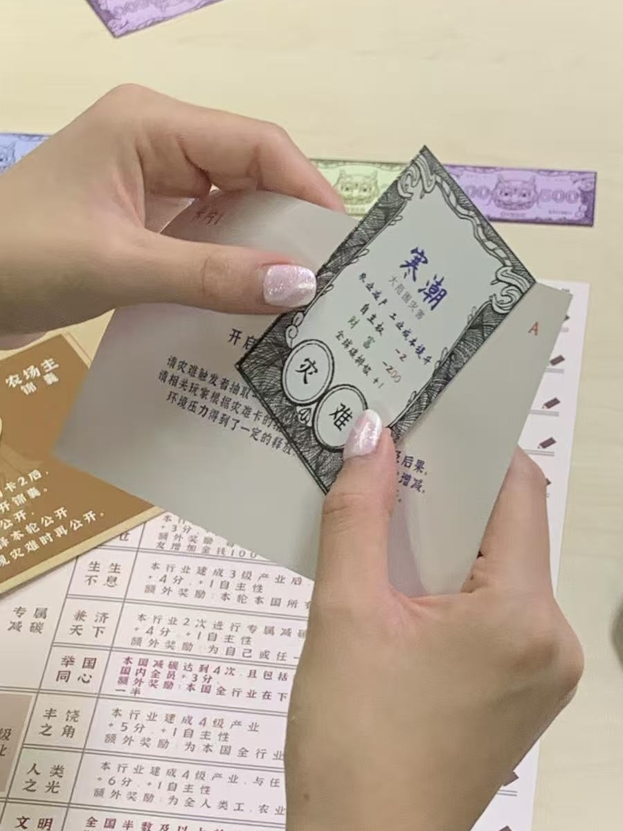 hand holding two cards