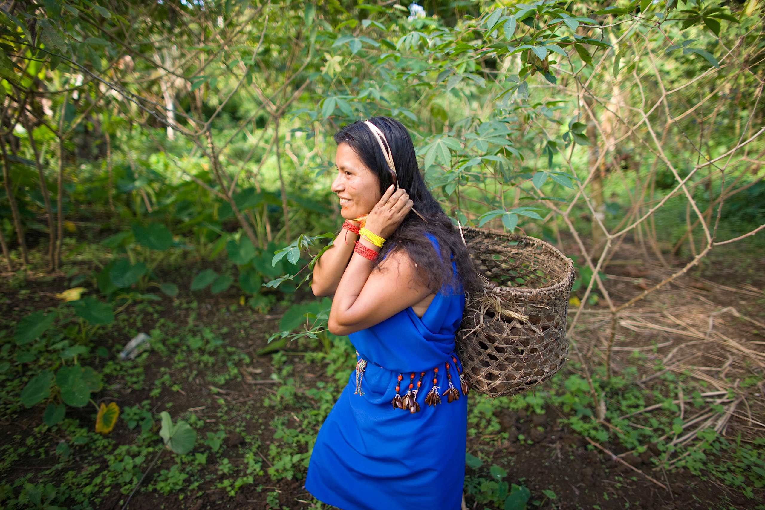 <p>A Shuar woman tending to a garden project in Guadalupe, southern Ecuador. The actions of Indigenous women are vital for the protection of the area’s tropical forests, but they struggle to get proper recognition (Image: Phil Borges / Danita Delimont / Alamy)</p>