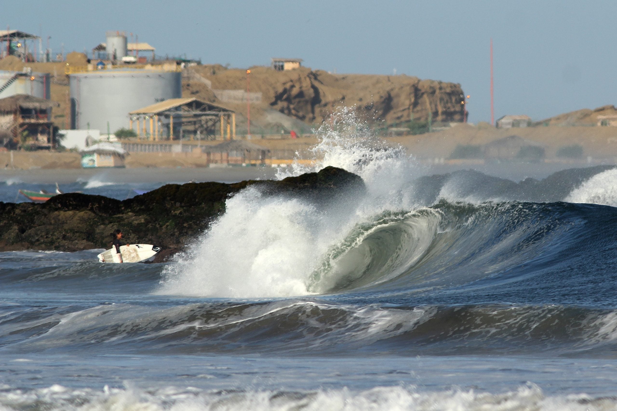 surfer entering the sea 