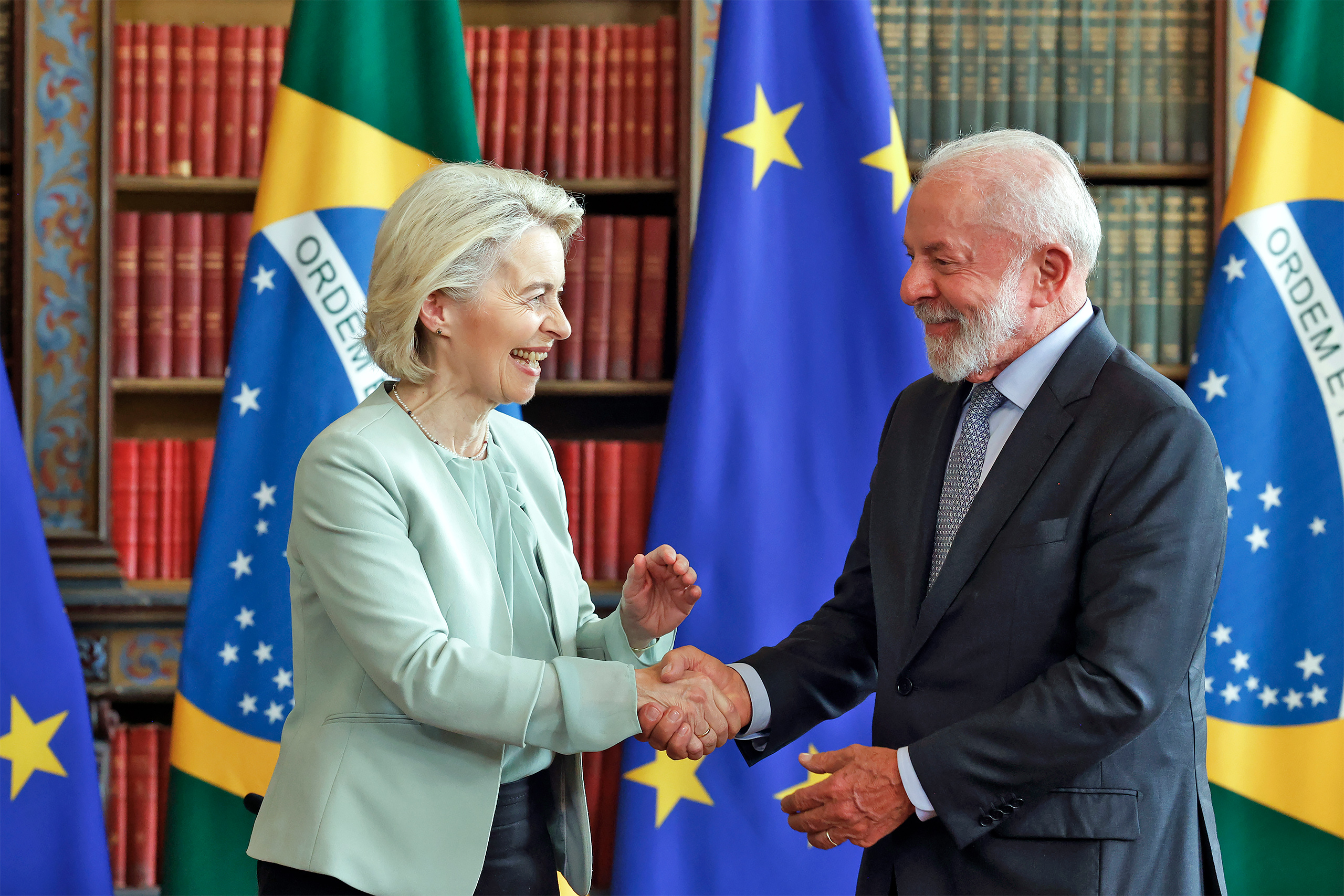 Brazil President Lula and president of the European Commission Leyen shake hands during a formal meeting