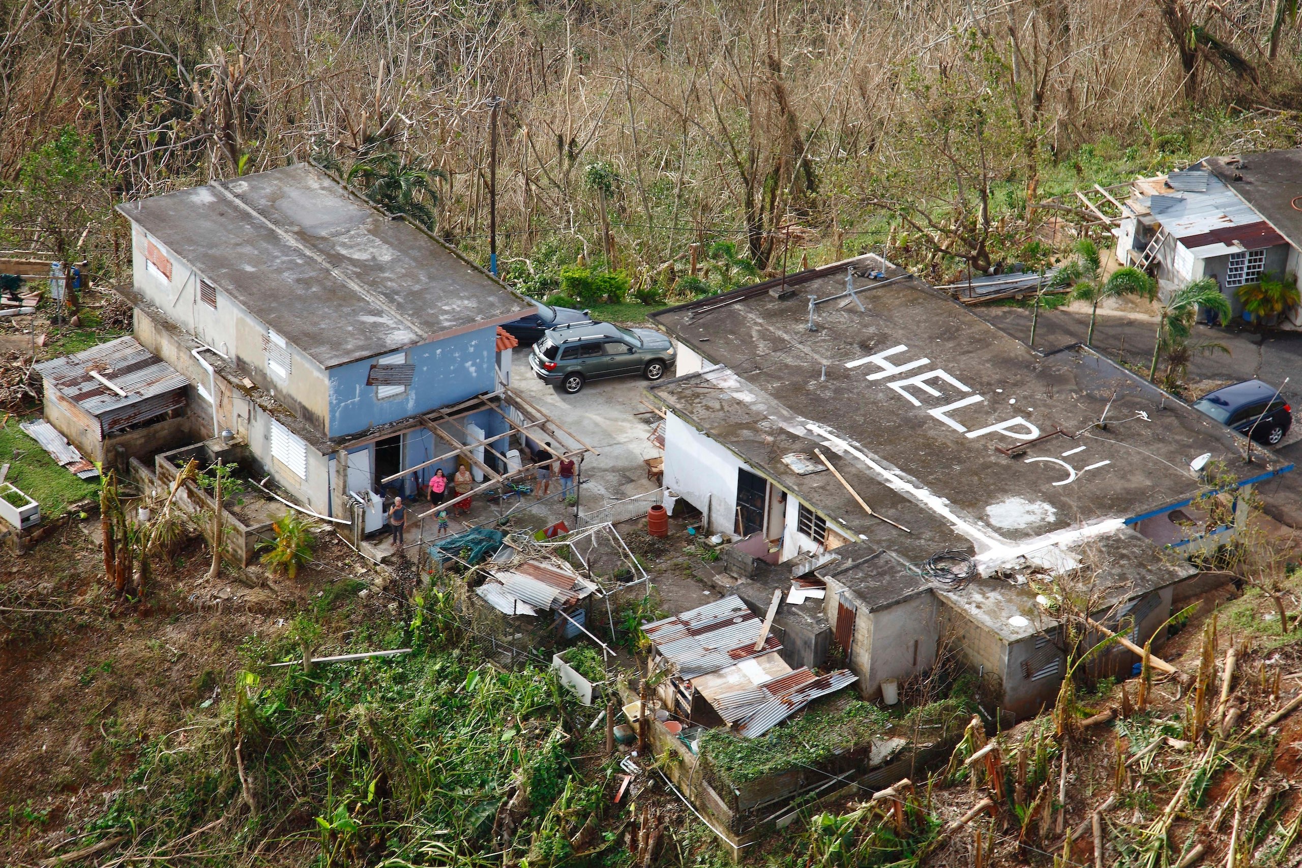 A home spotted with the word 'HELP' painted on its roof