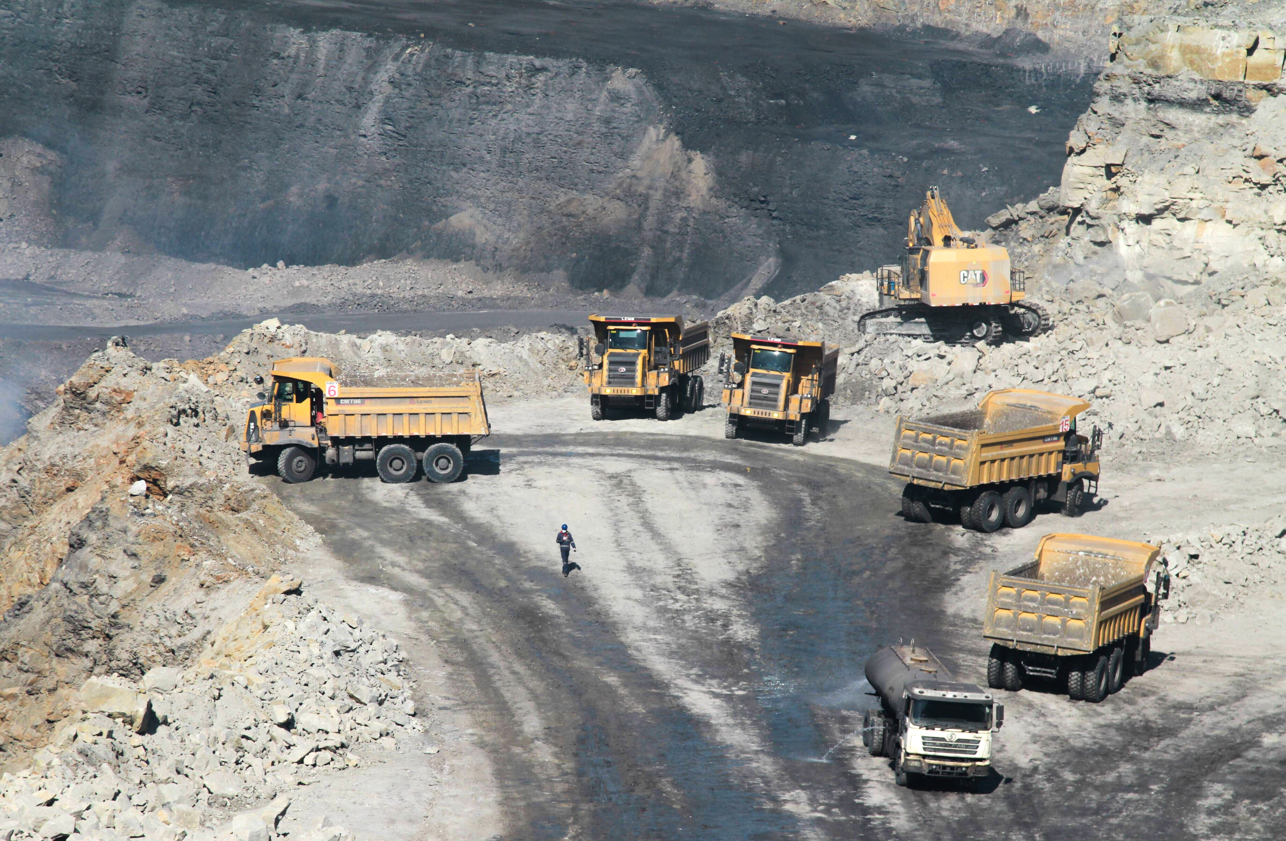 large trucks near open-cast coal mine