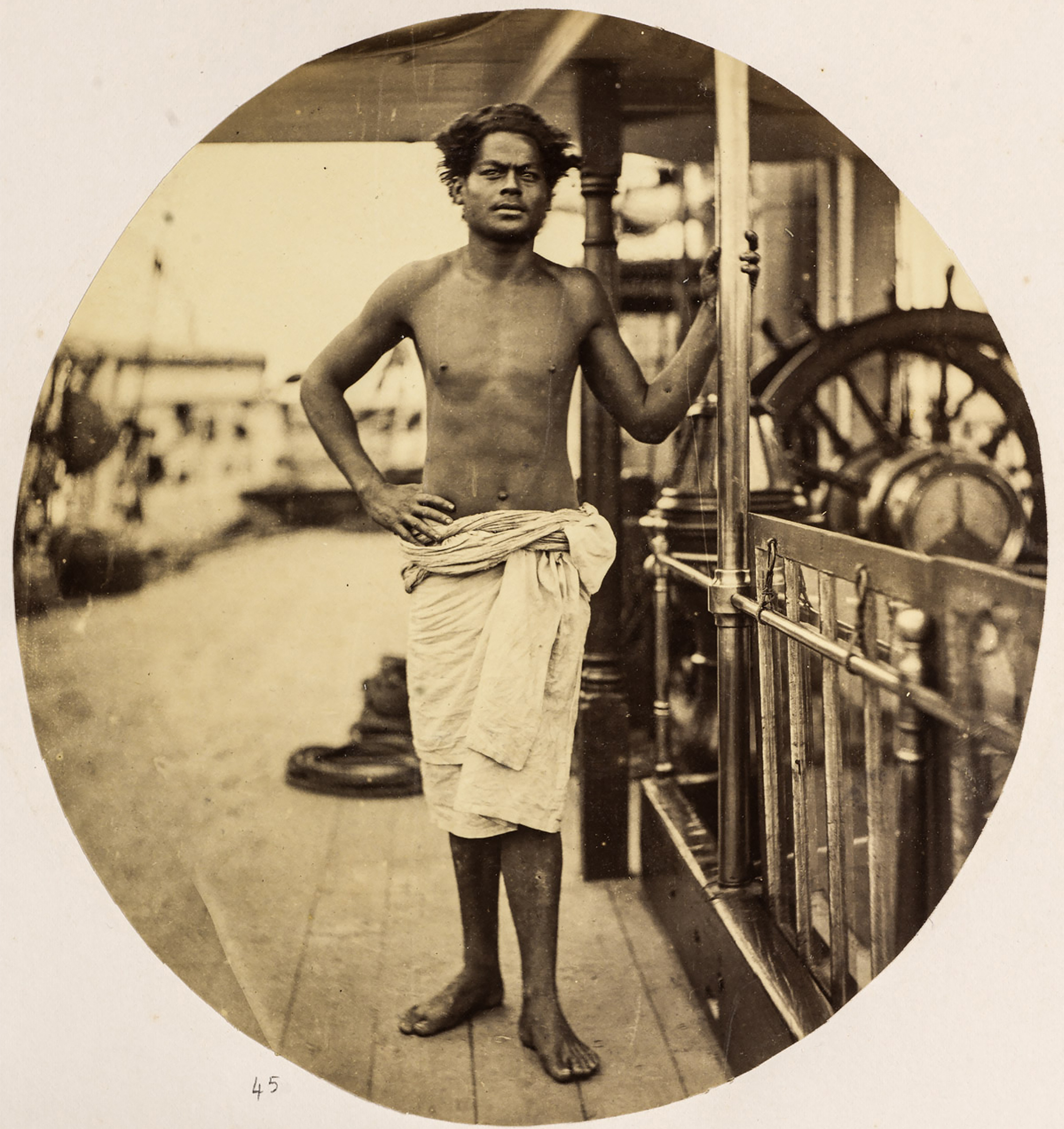 old portrait of shirtless man on ship
