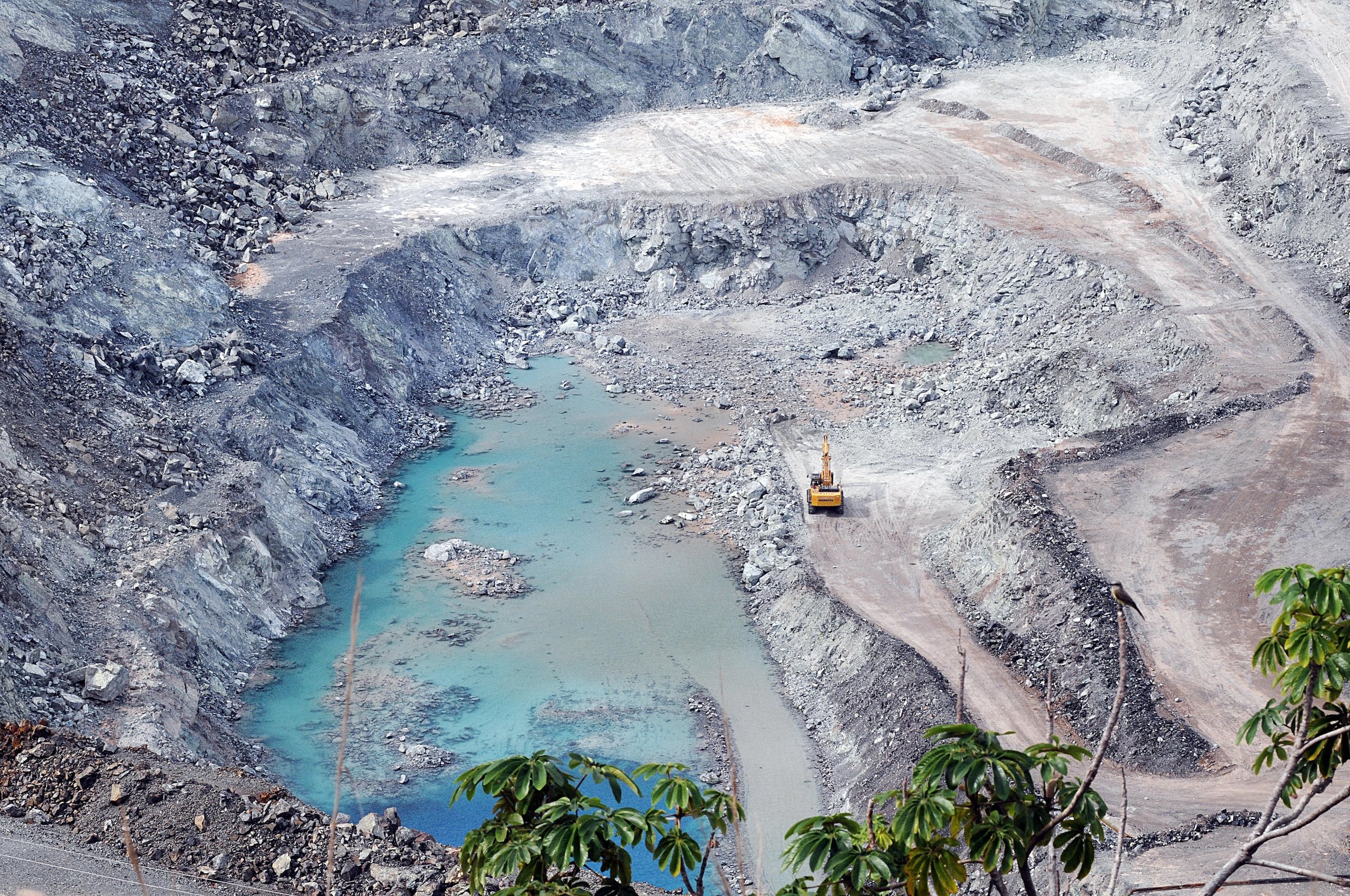 A large pit filled with blue water