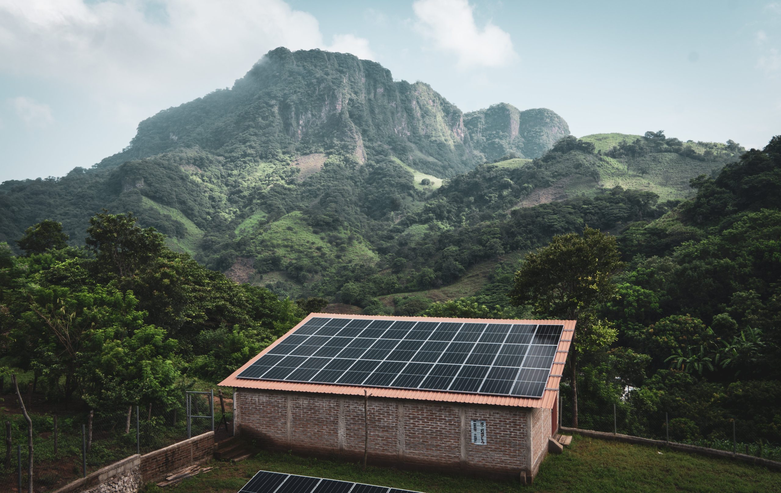 solar panels on building near mountains