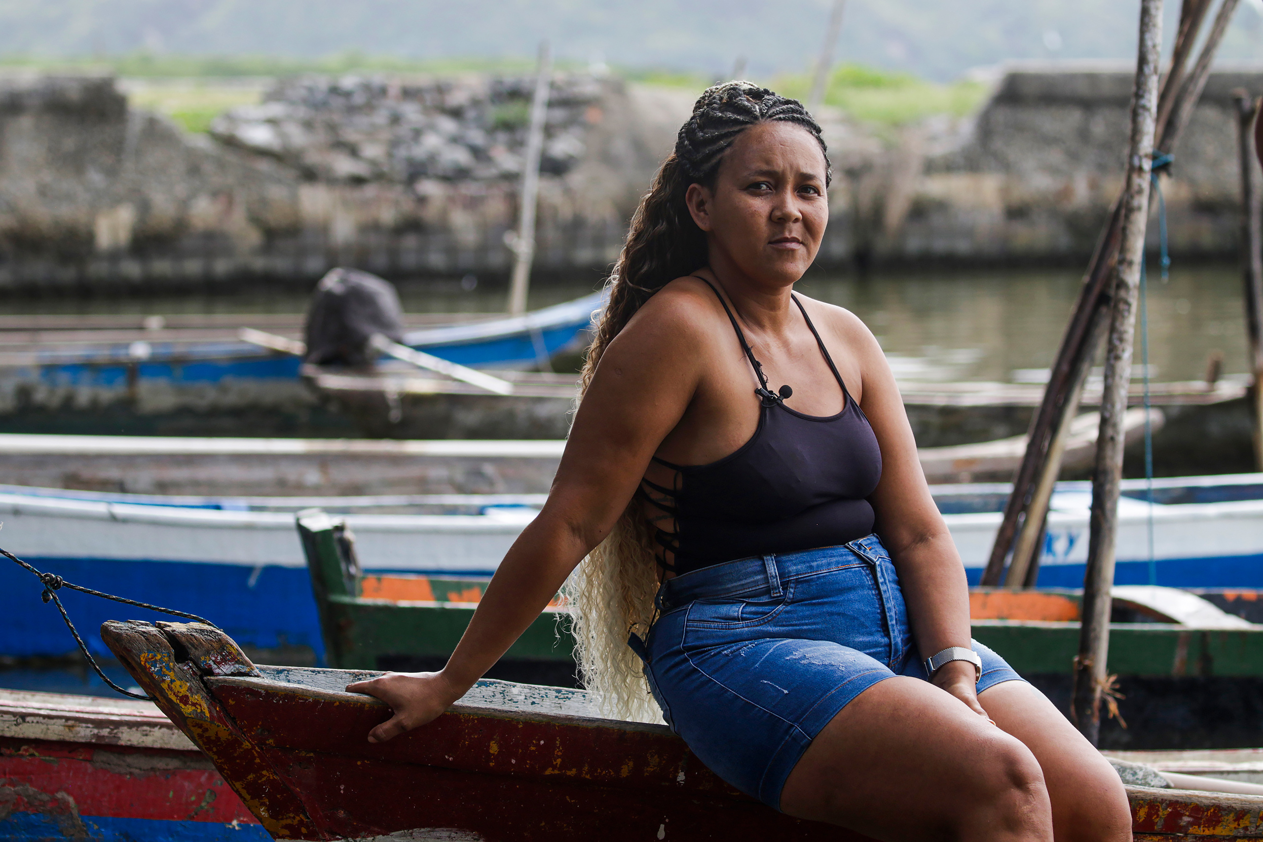 A woman sitting on a raft off the coast