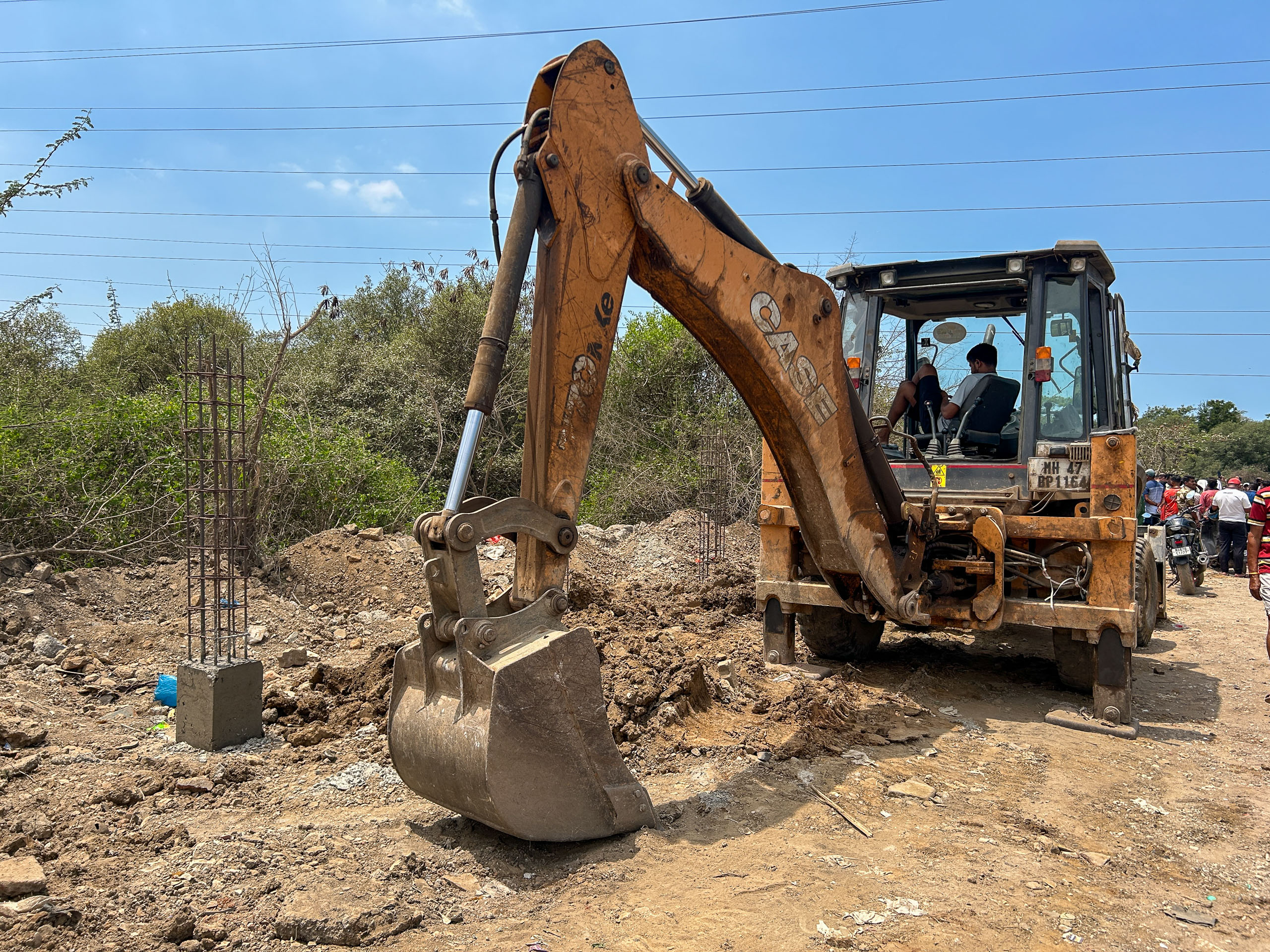 backhoe digging up soil