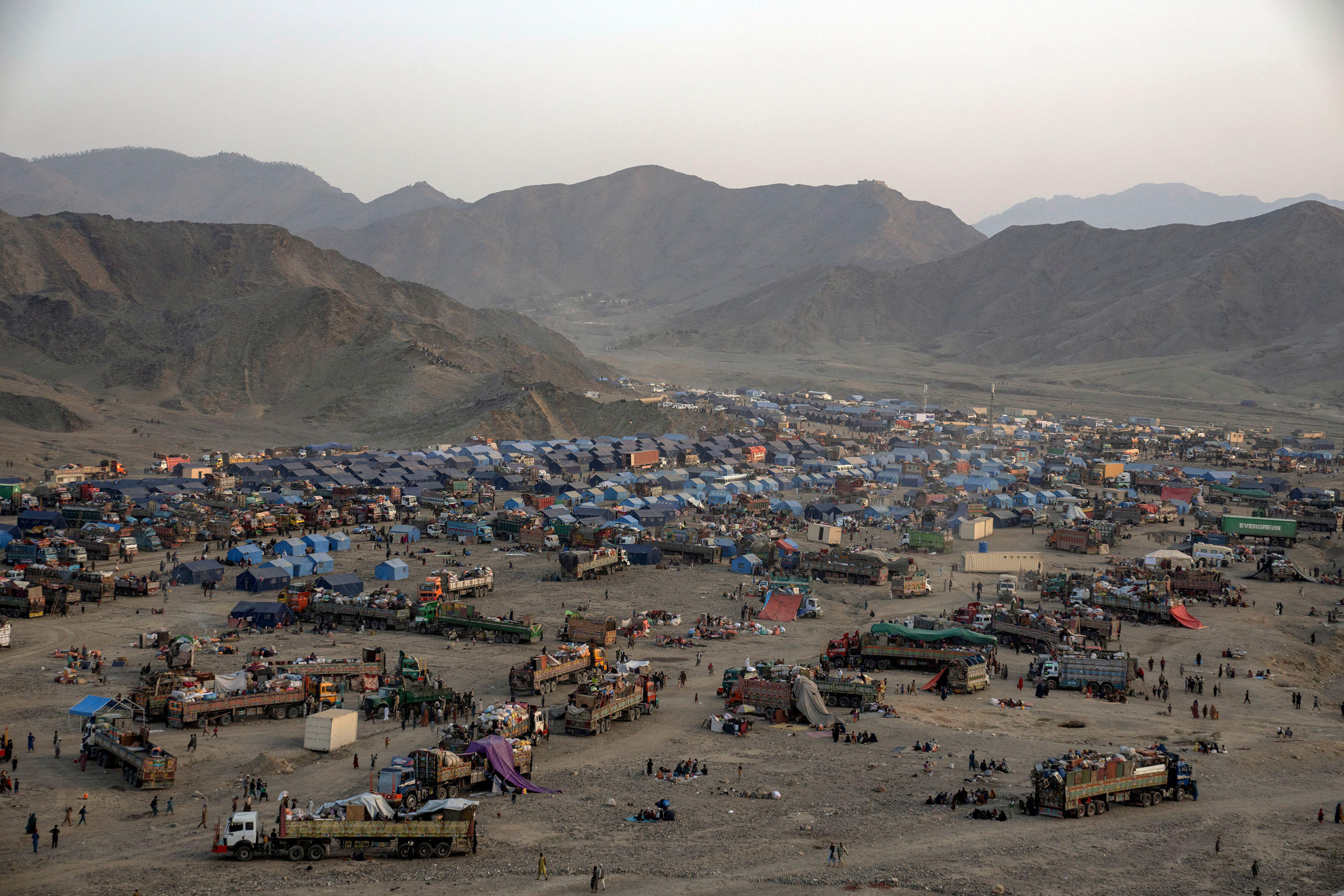 large camp at base of hills