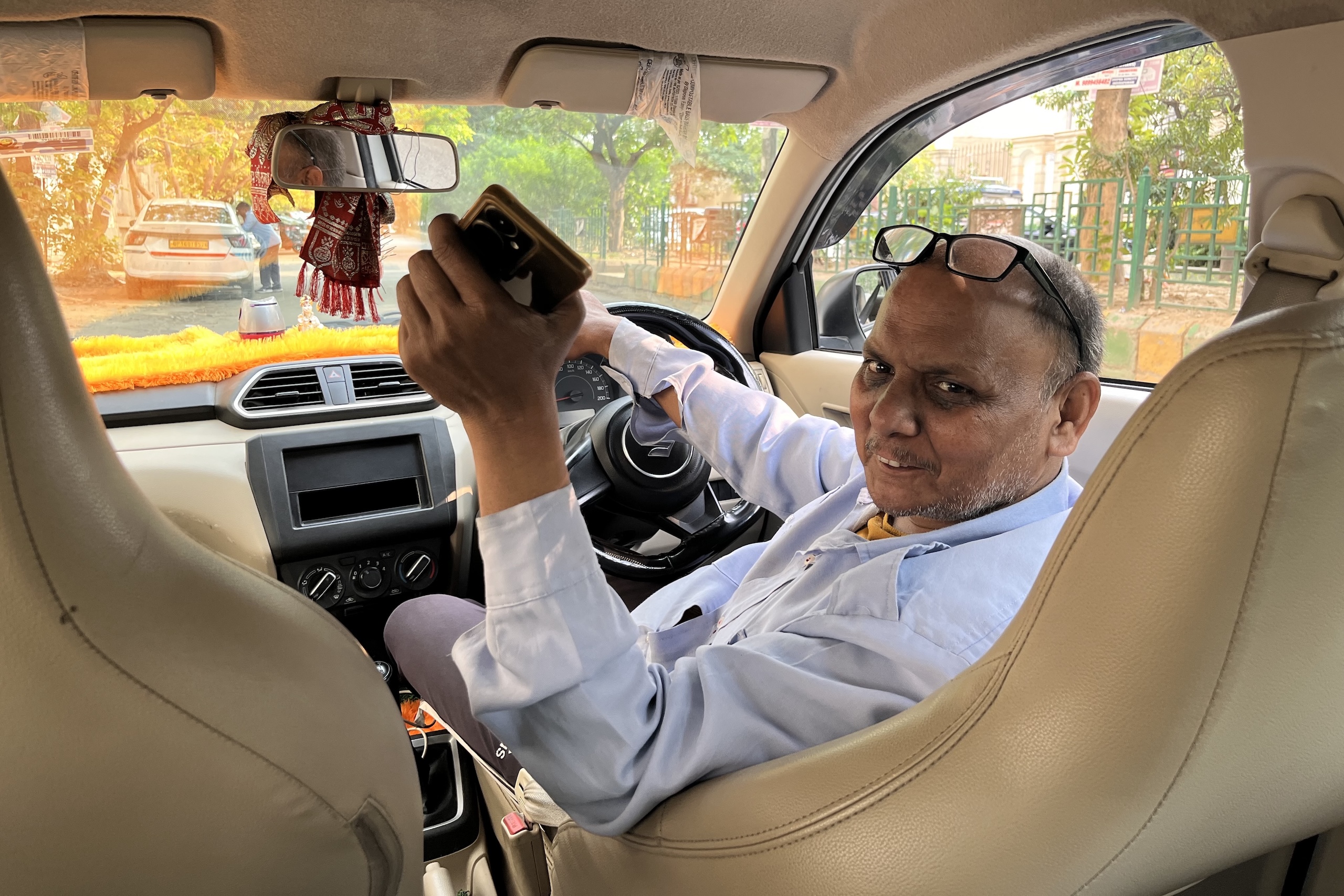 driver in front seat of car