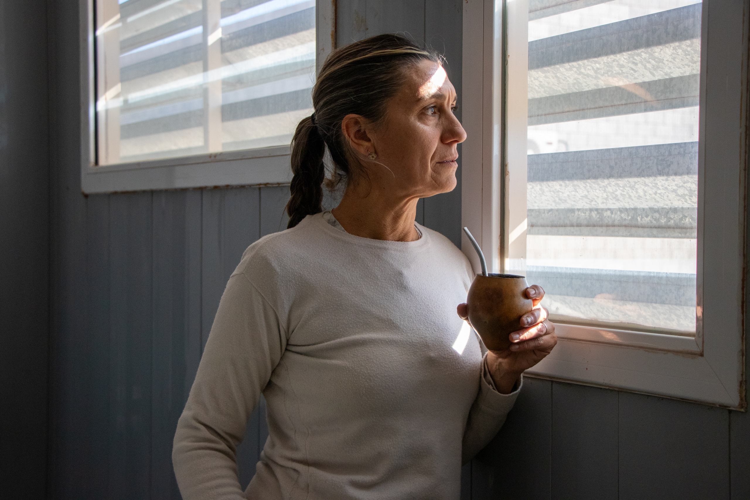 woman looking out window