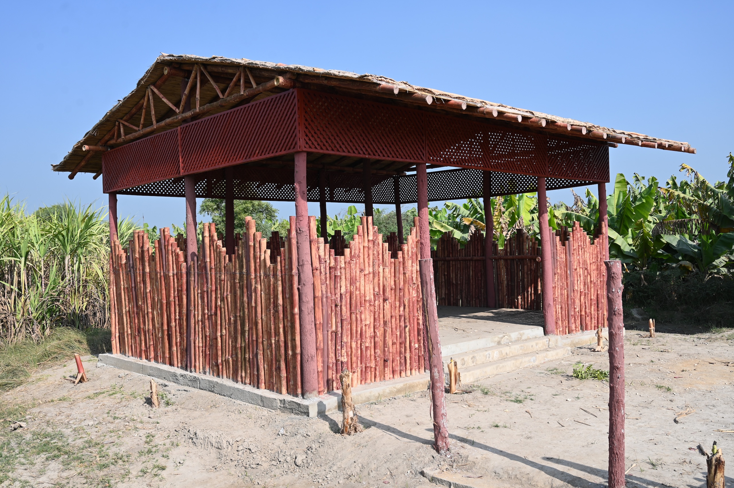 A wooden structure featuring a bamboo roof