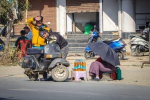 people on side of road in heat