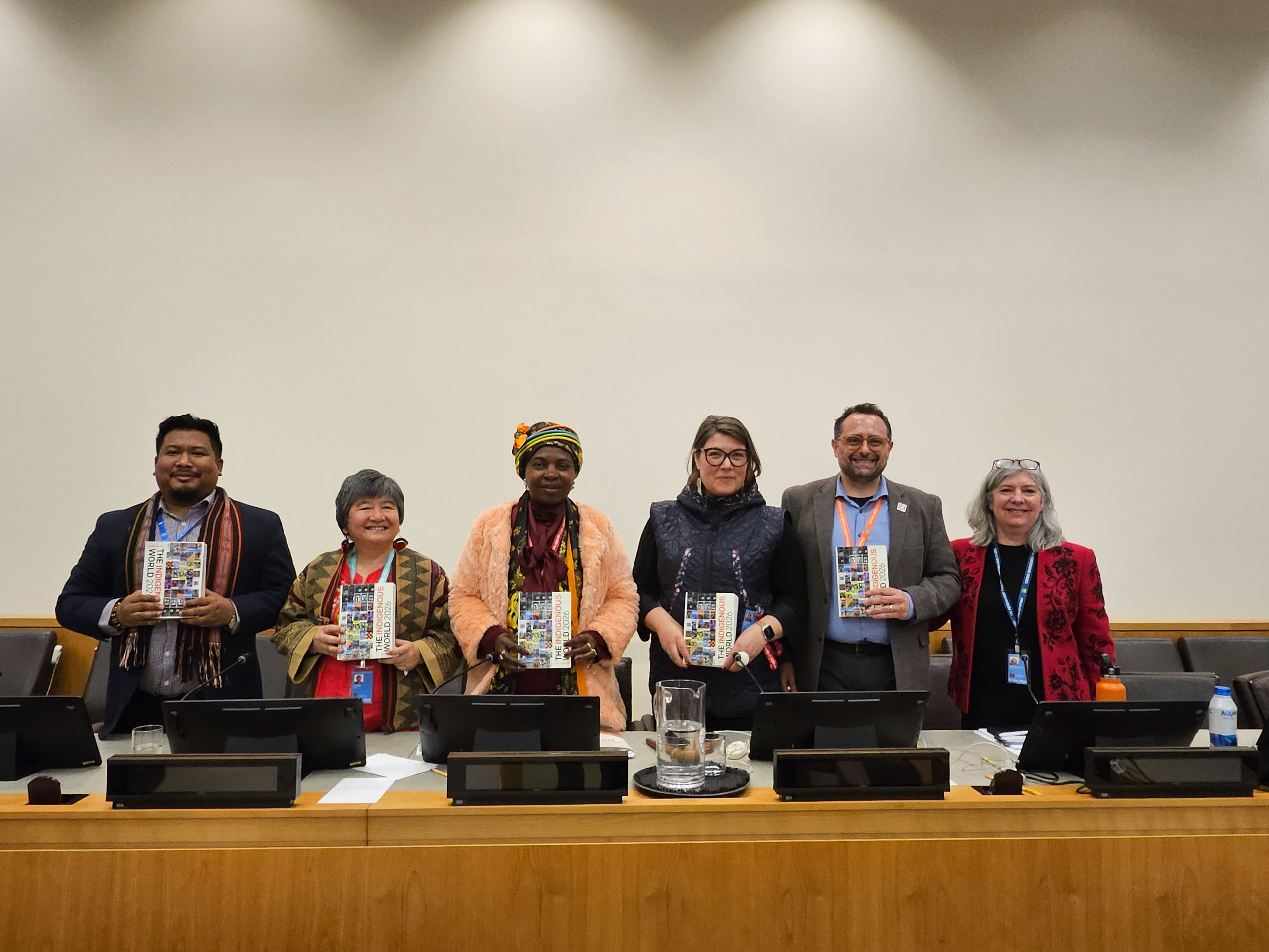 people lined up holding books