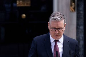 Keir Starmer speaking into microphone