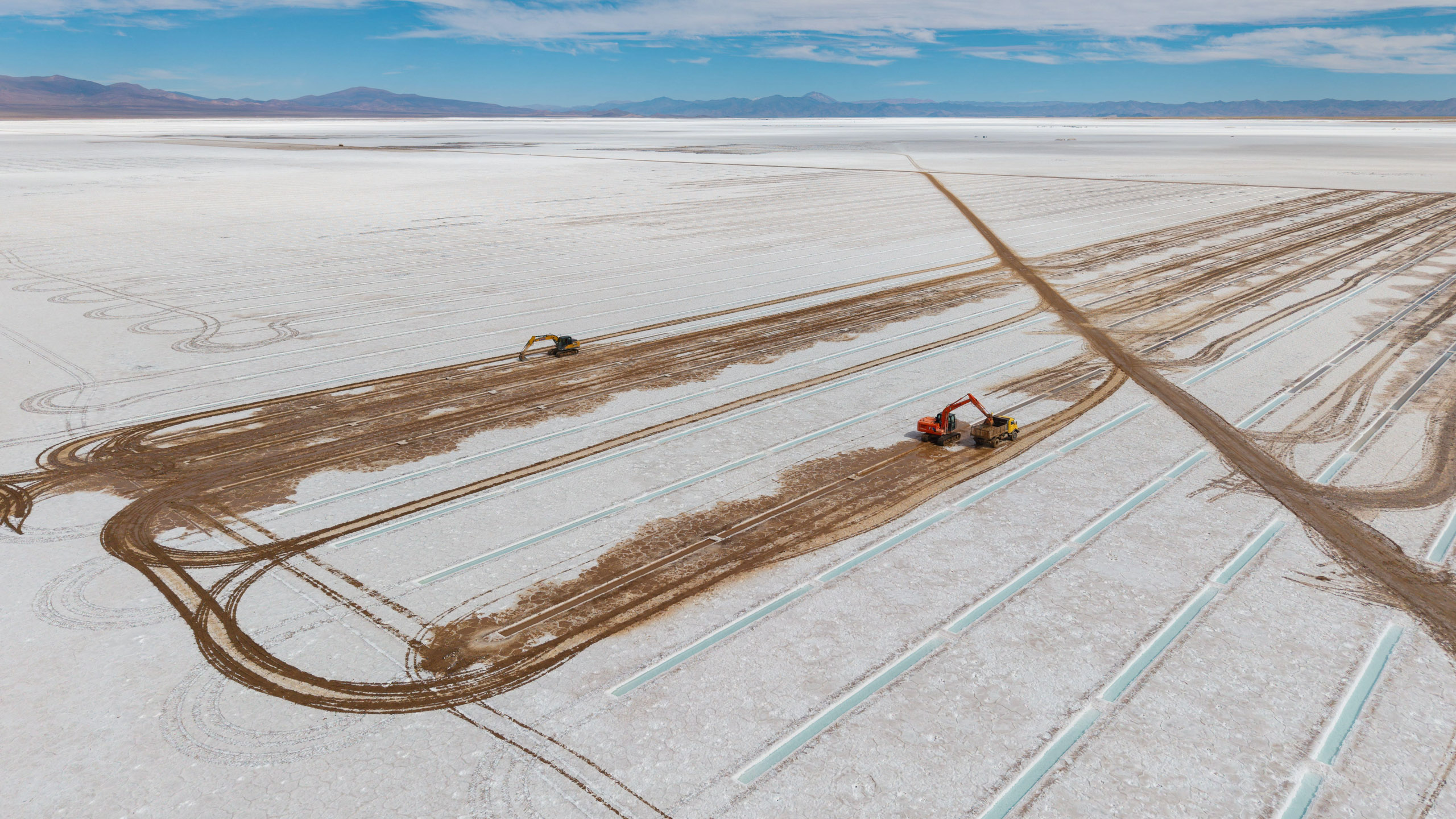 dark paths made by machines in salt flat