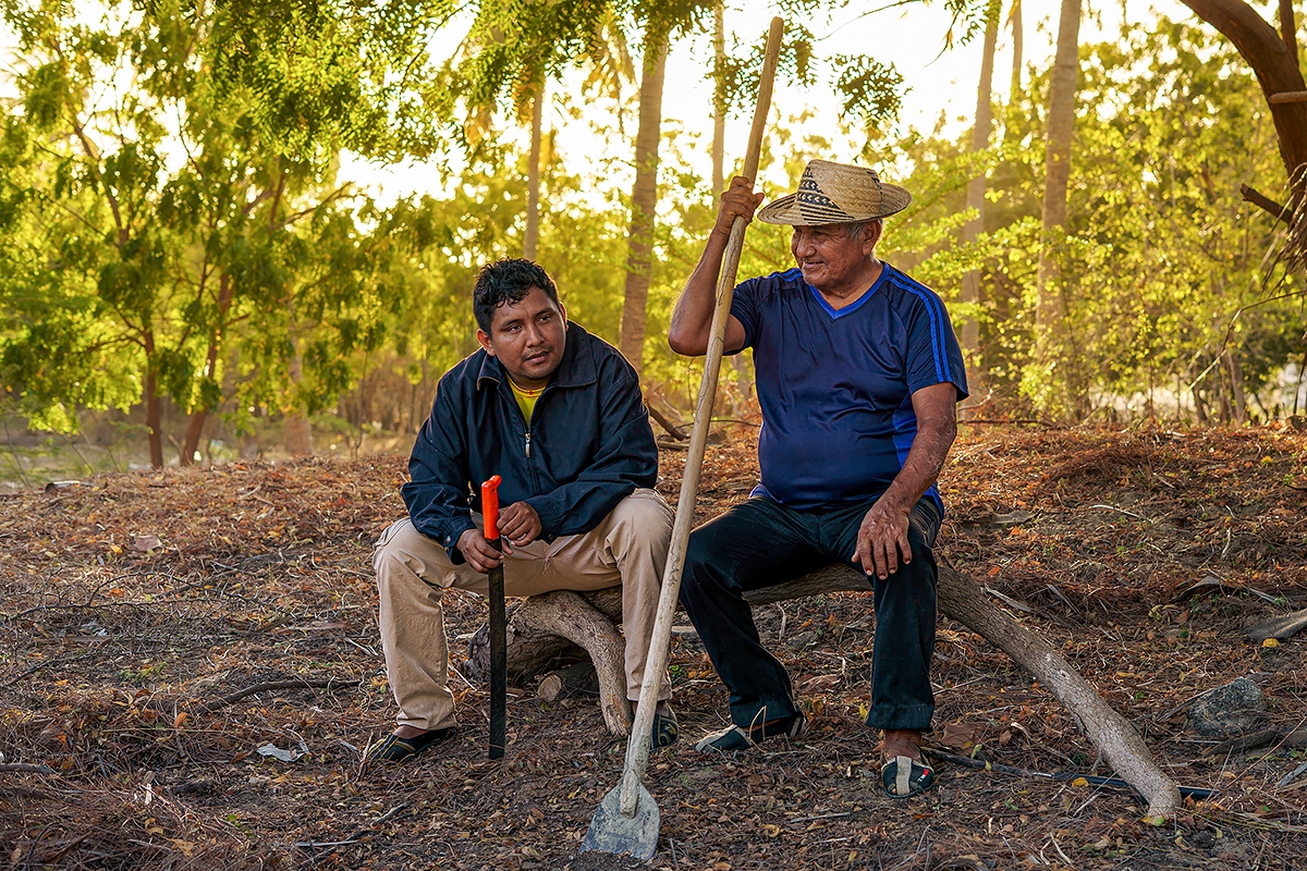 two men seated outdoors