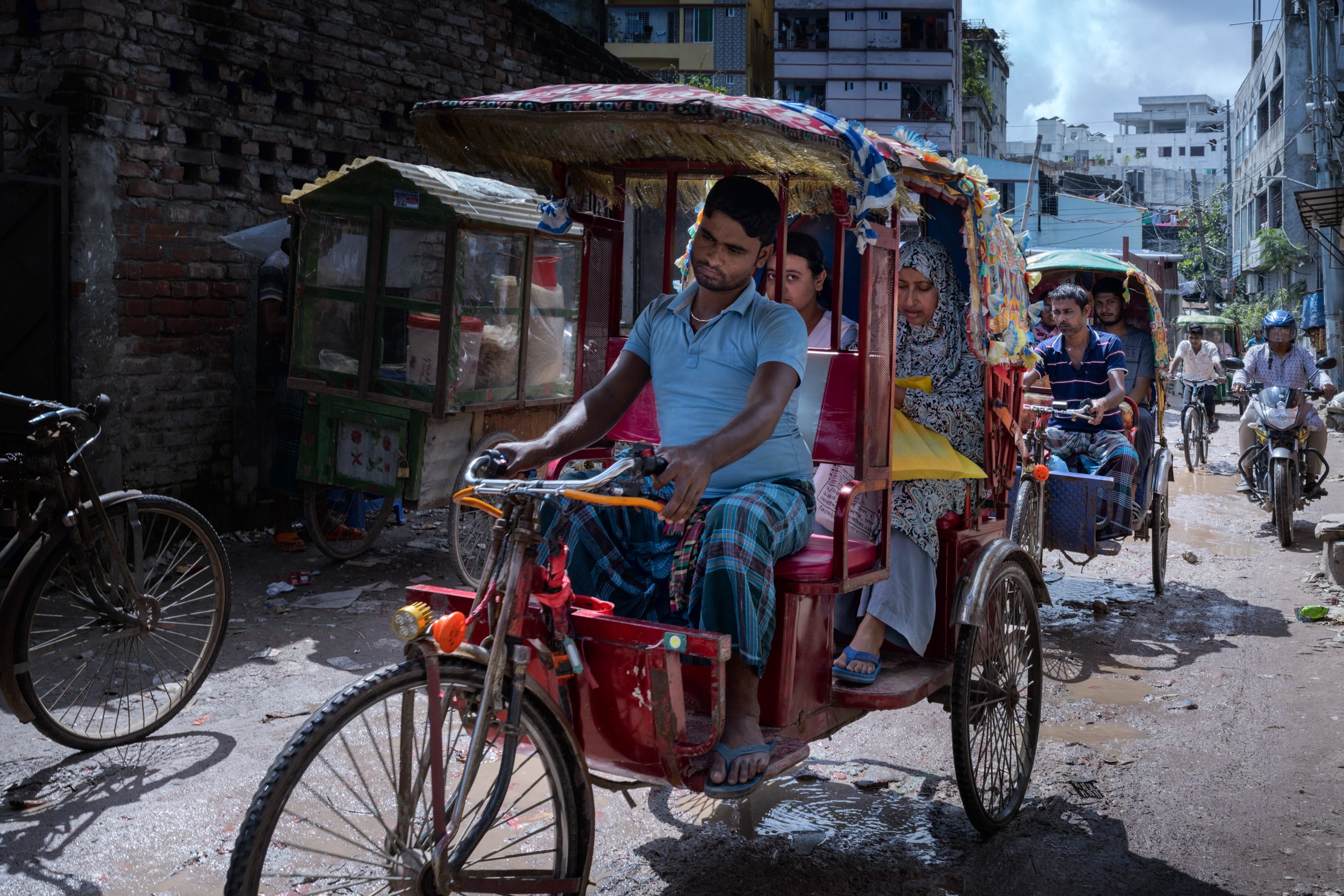E-rickshaws driving-down the street