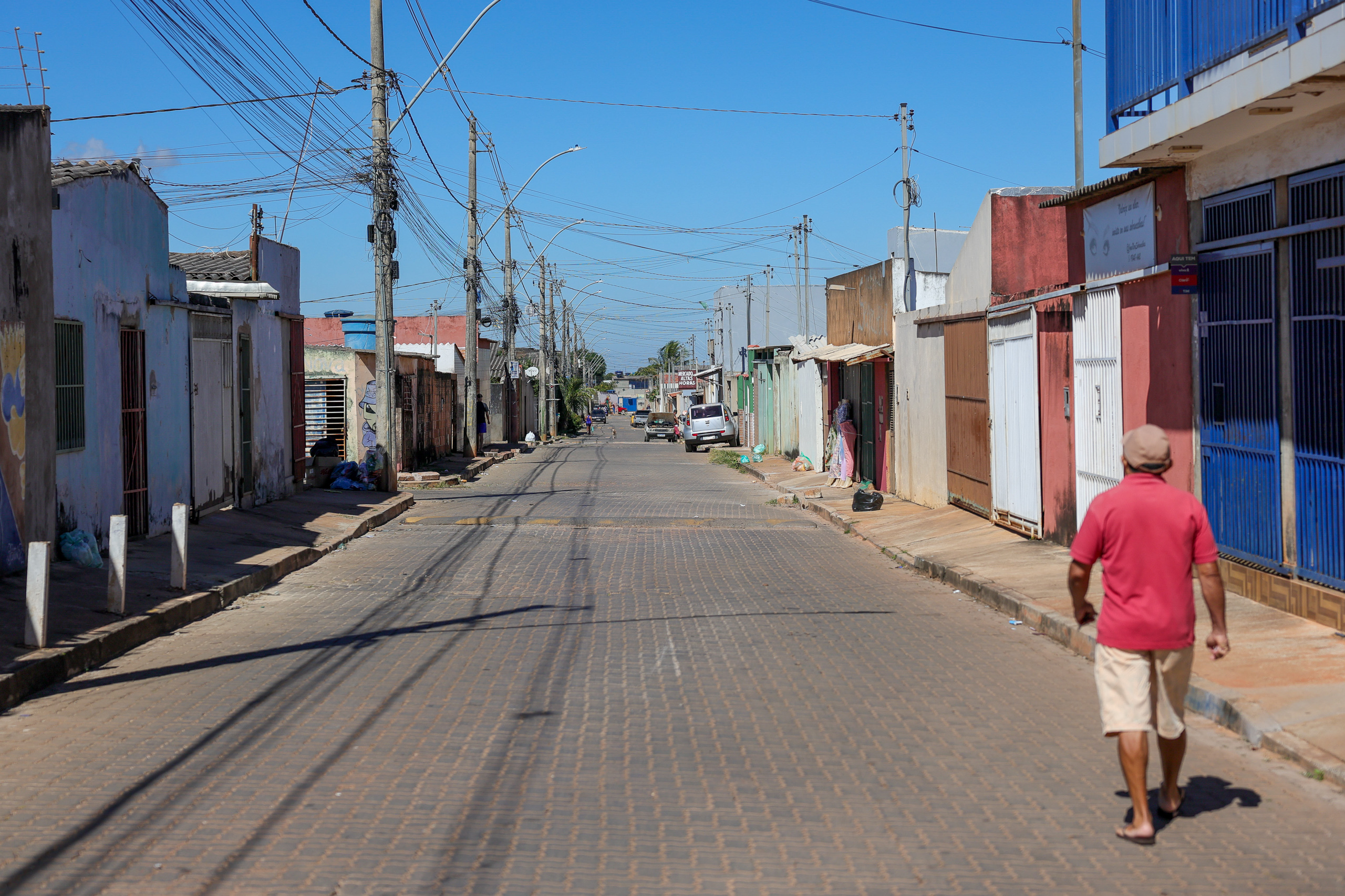 Man walking down a street in a small town