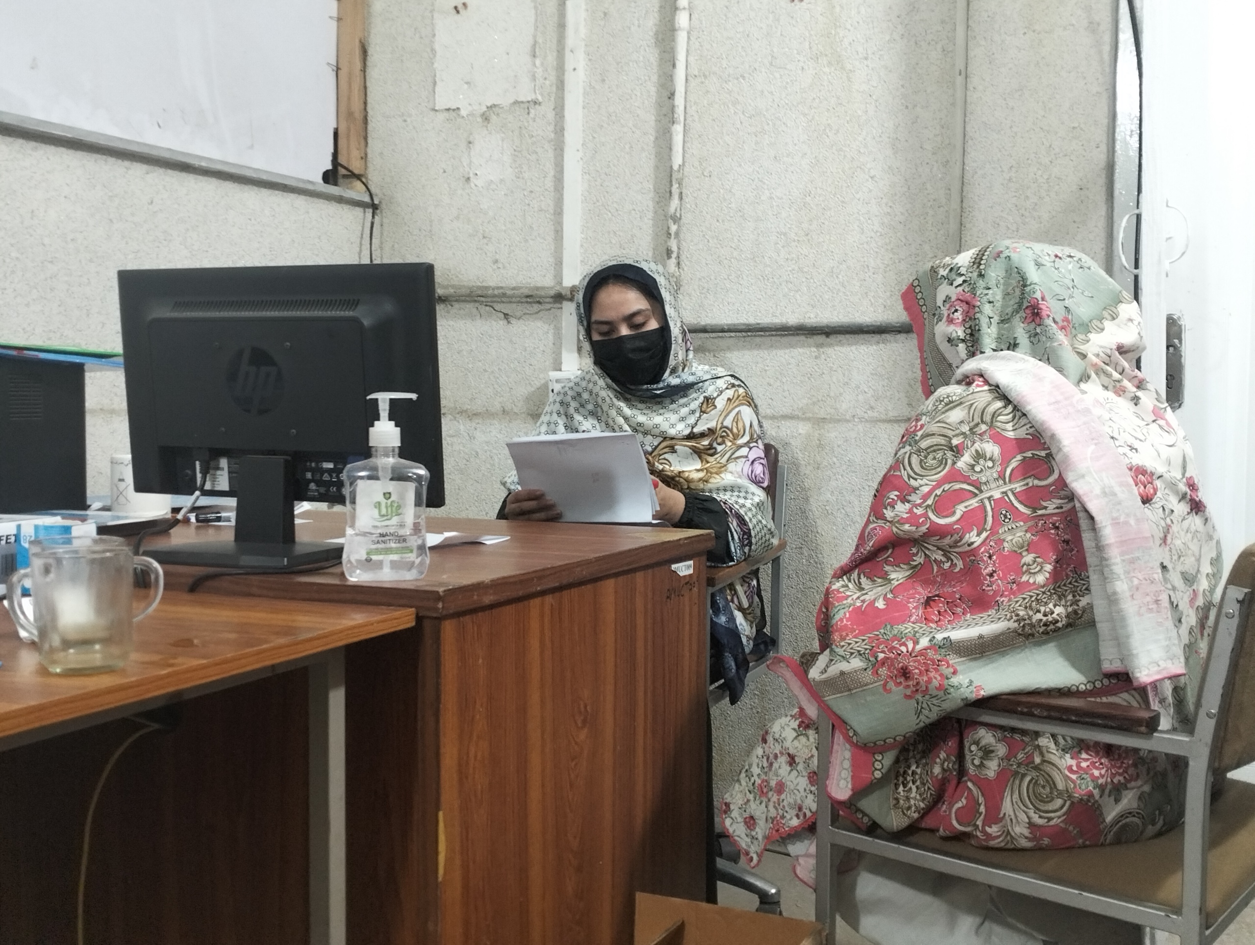 A patient has a consultation with a healthcare in a clinic 