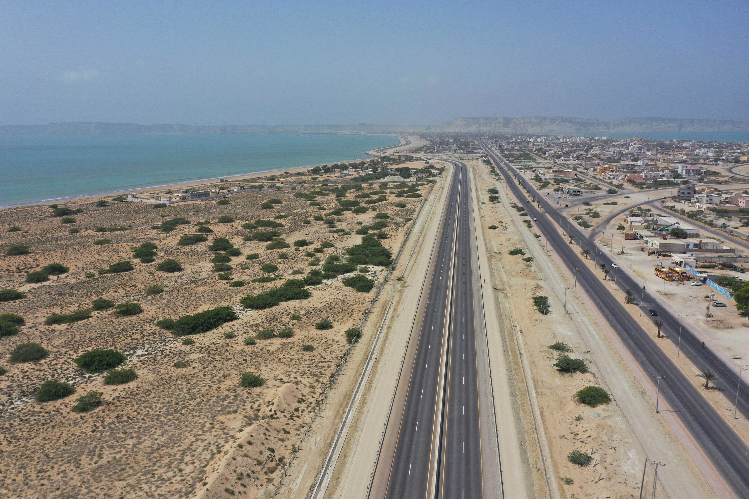 Aerial view of a highway alongside a beach