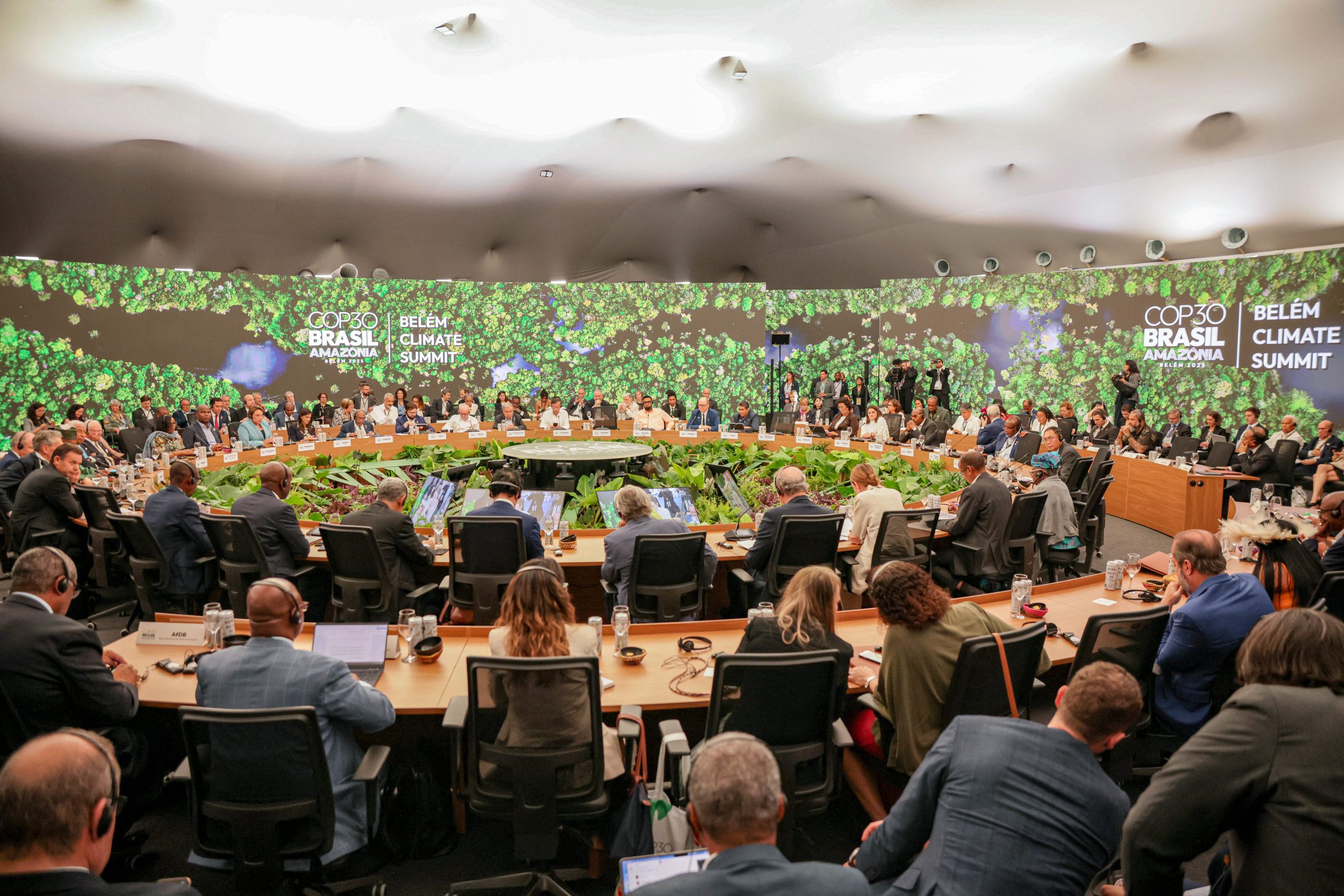 concentric rows of seated people in business attire
