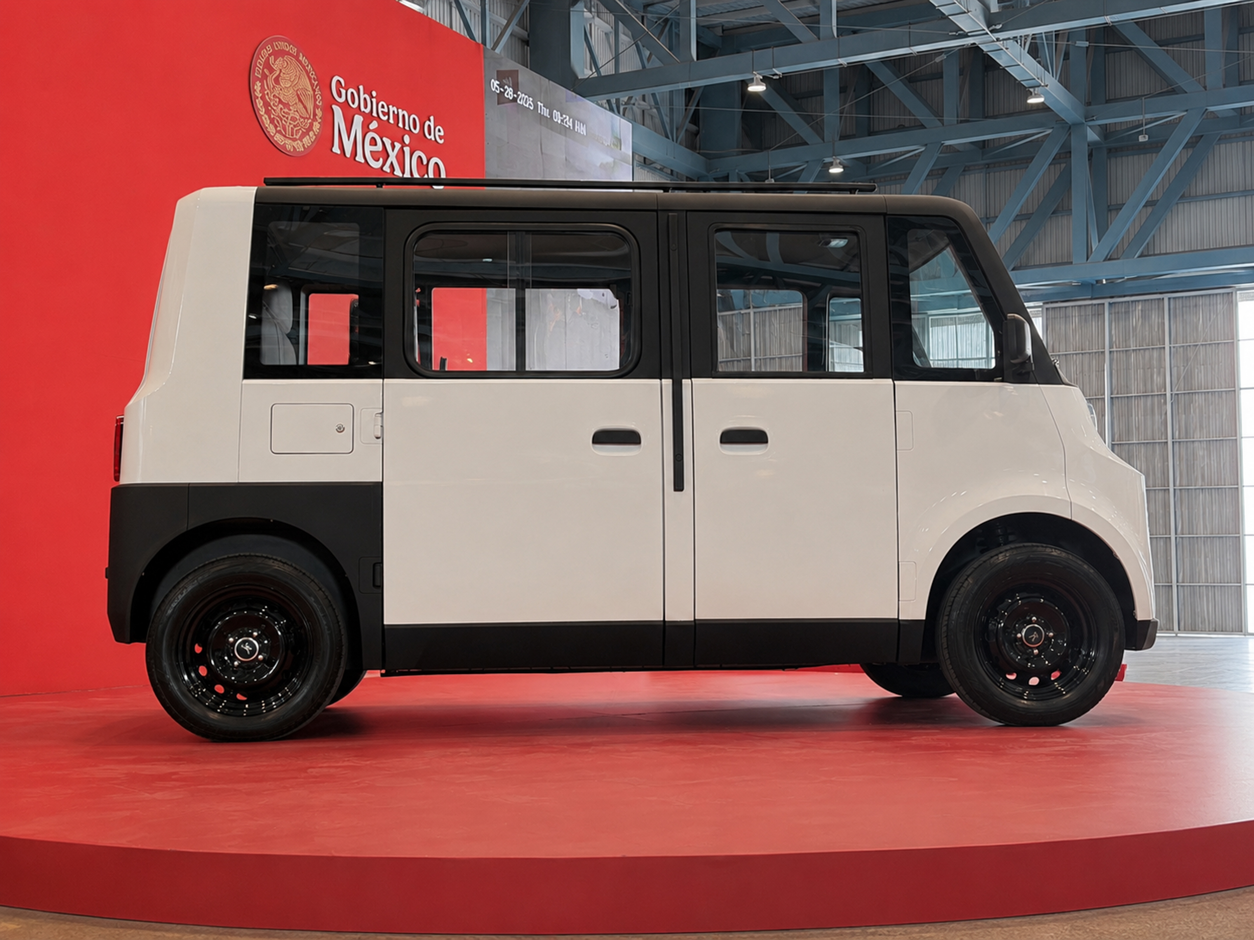 Olinia electric vehicle on red platform