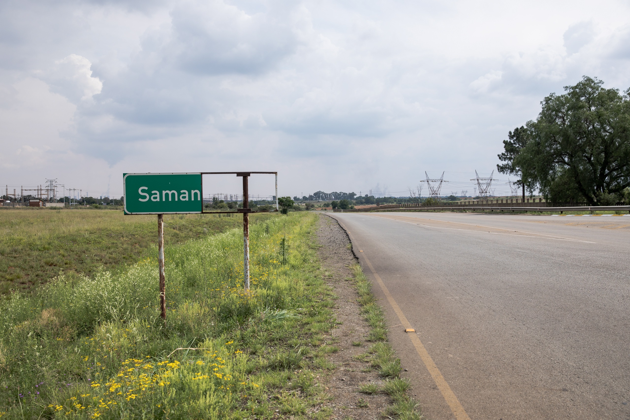 road sign near empty road