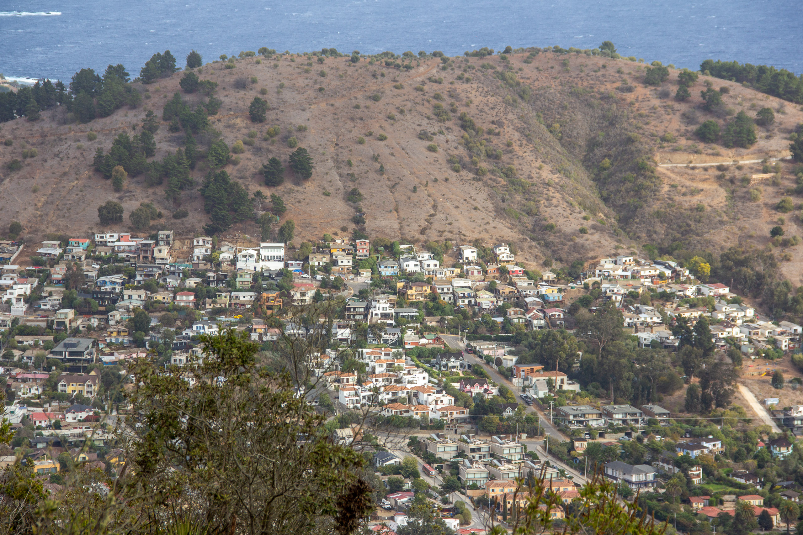 A panoramic view of a city from a hilltop