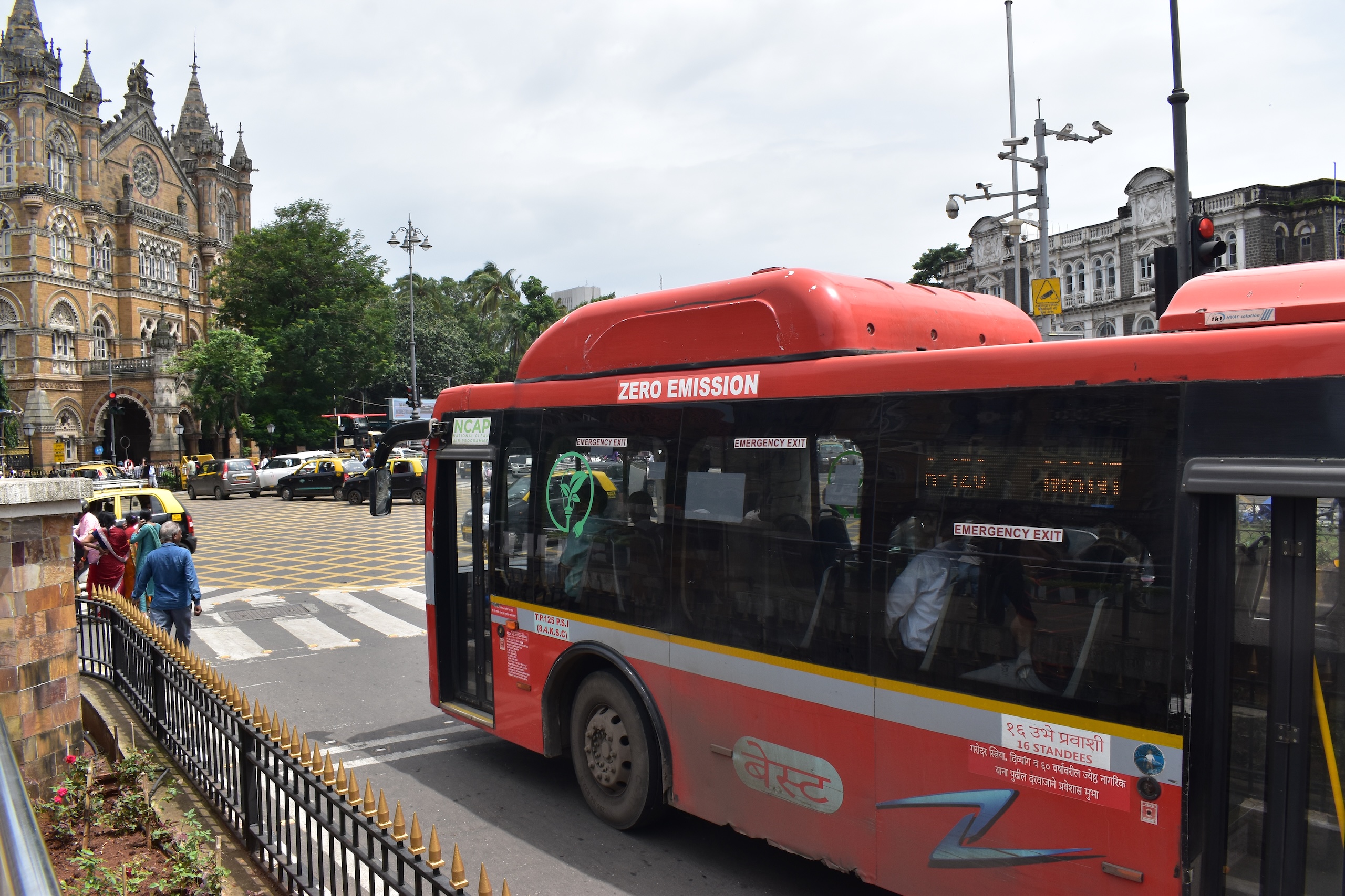 red bus on road
