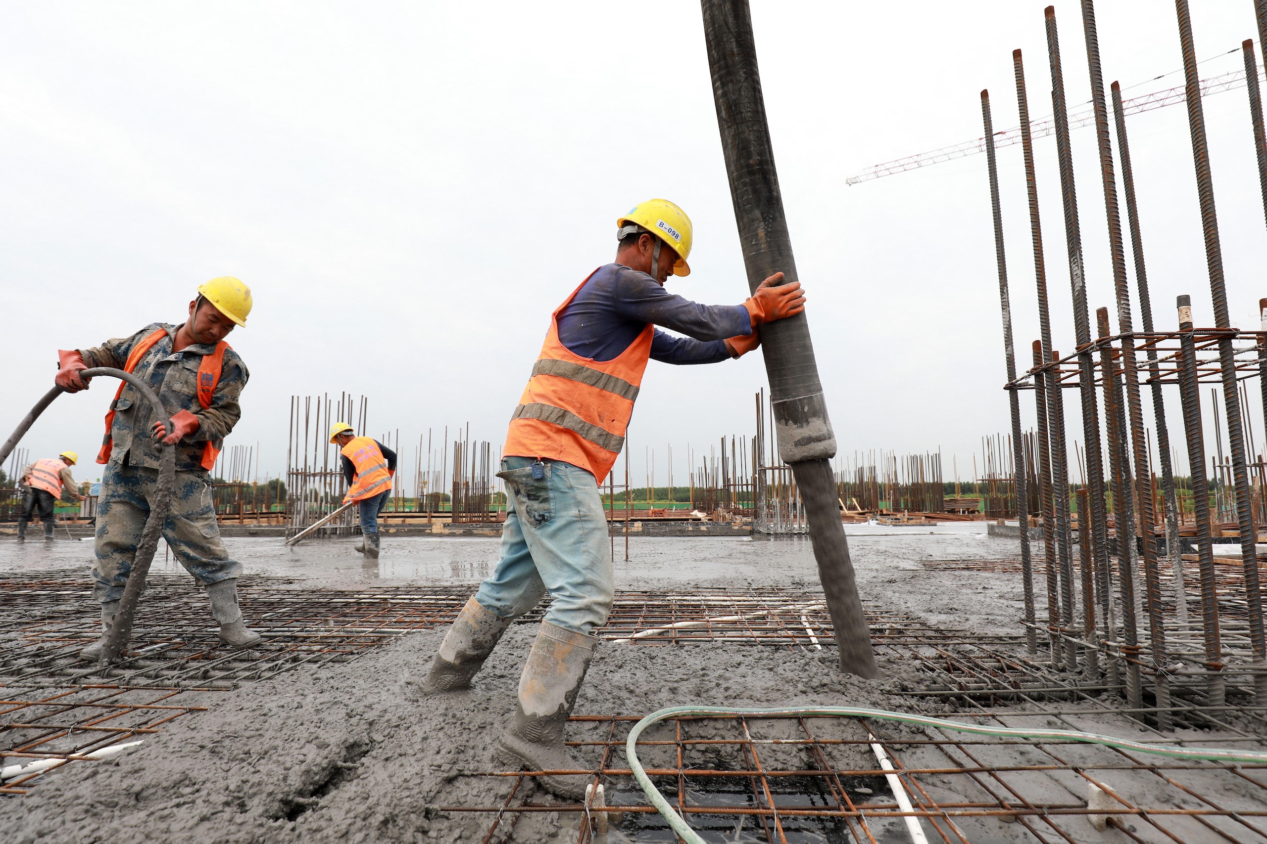 <p>Concrete being poured at a construction site in Luannan, Hebei province (Image: YongXin Zhang / Alamy)</p>
