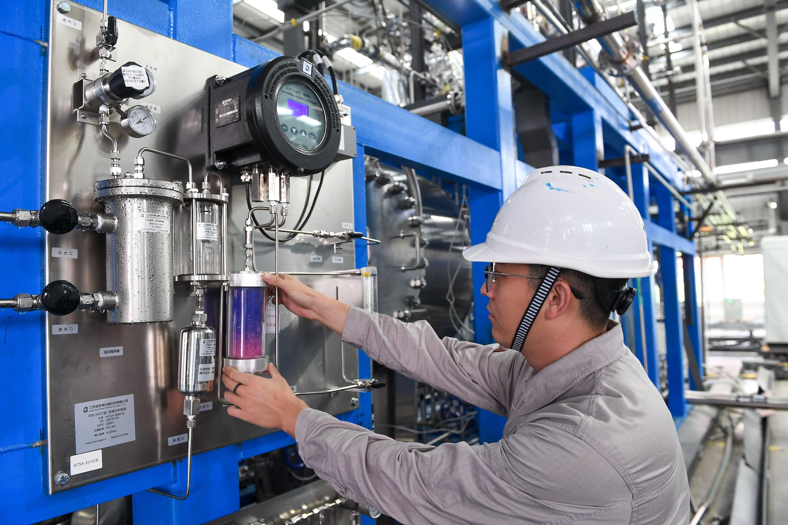 <p>Hydrogen has the potential to replace fossil fuels in many transport and industrial applications. Here hydrogen production equipment is checked in Changchun, Jilin province (Image: Zhang Nan / Xinhua / Alamy)</p>