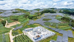 An aerial photo of a solar power station in a mountain area