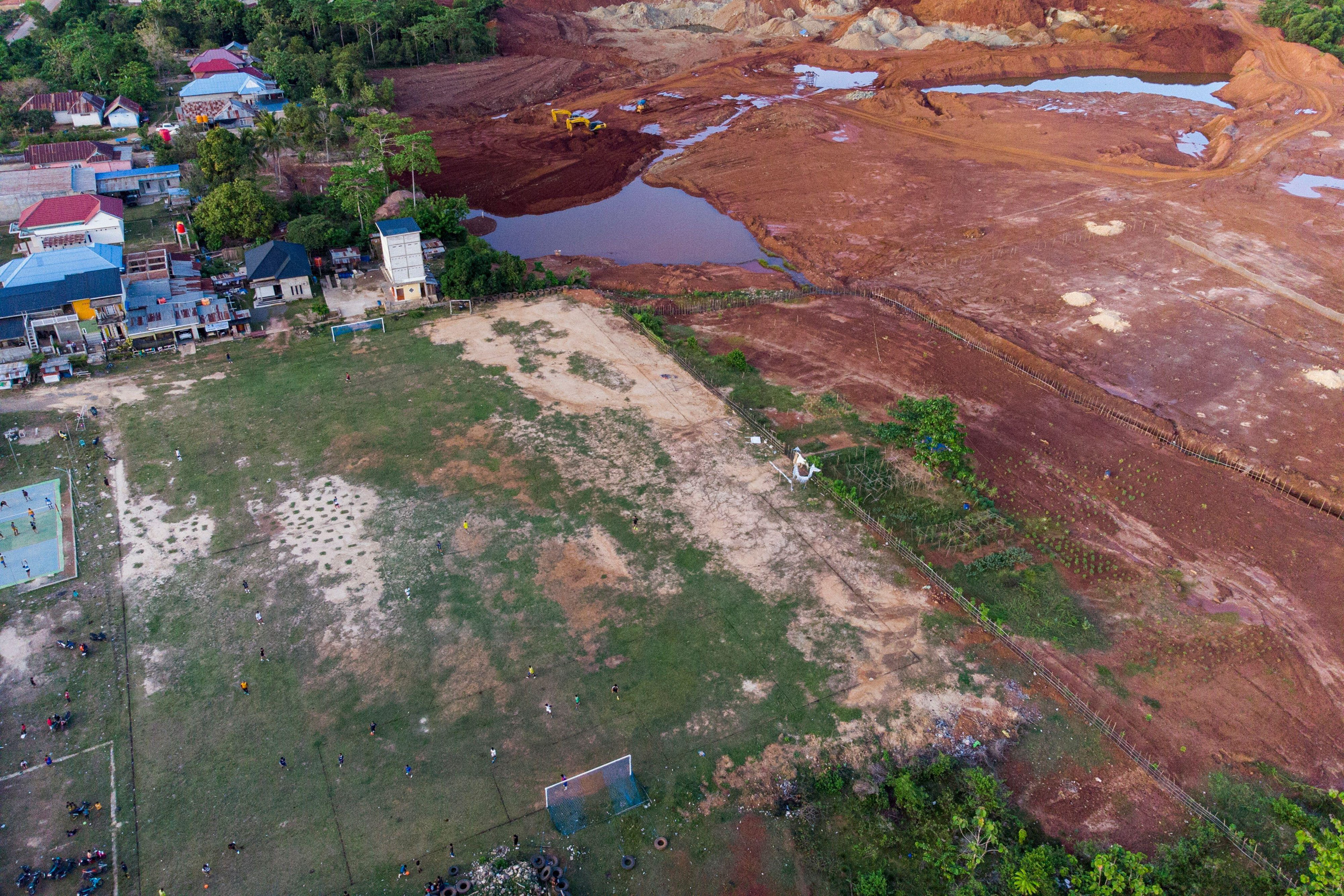 <p>A community football pitch next to a nickel mine in Torobulu, in Indonesia’s Southeast Sulawesi province (Image: Yusuf Wahil / Associated Press / Alamy)</p>