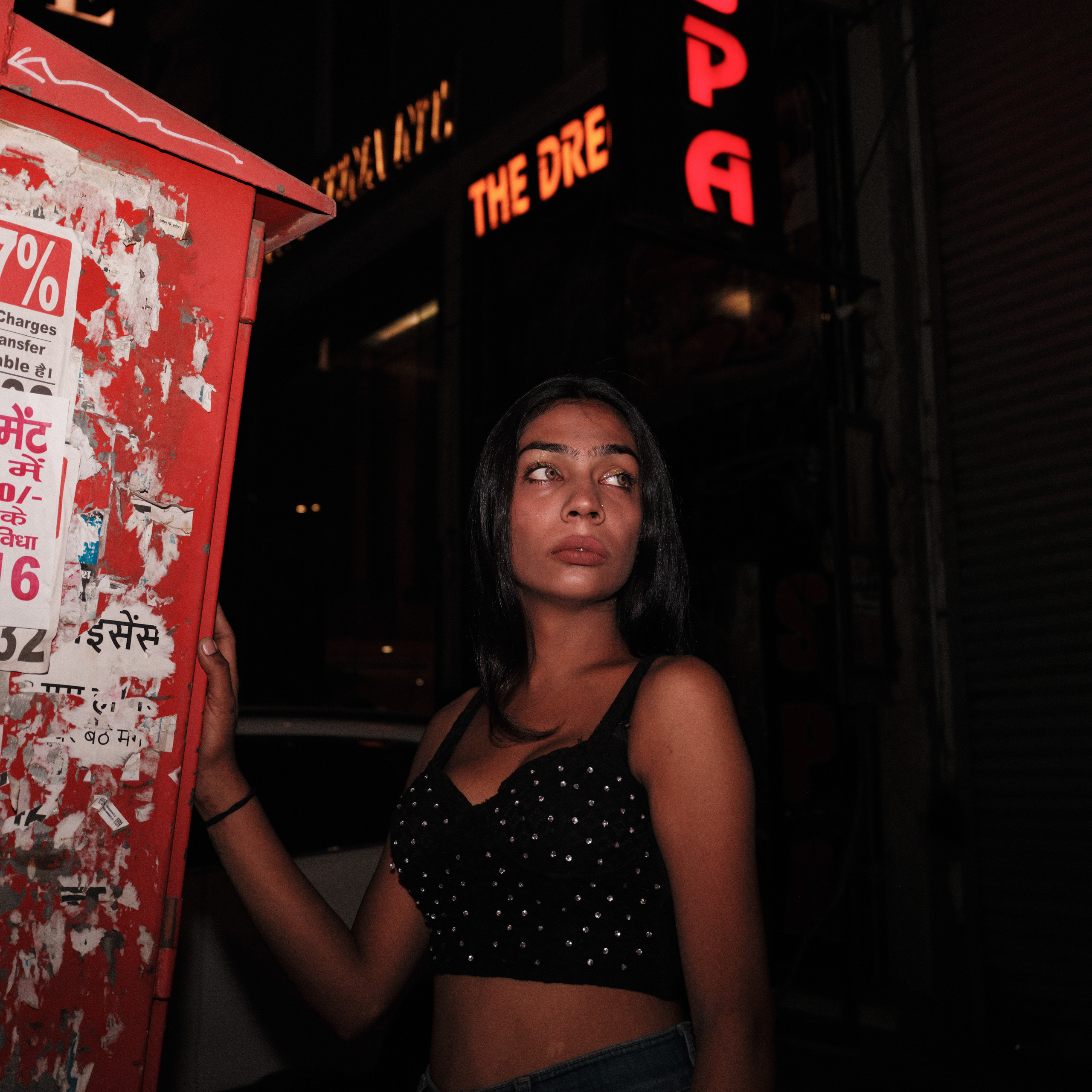 woman standing outside at night