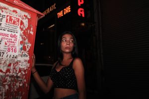woman standing outside at night
