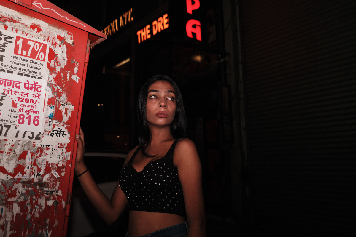 woman standing outside at night