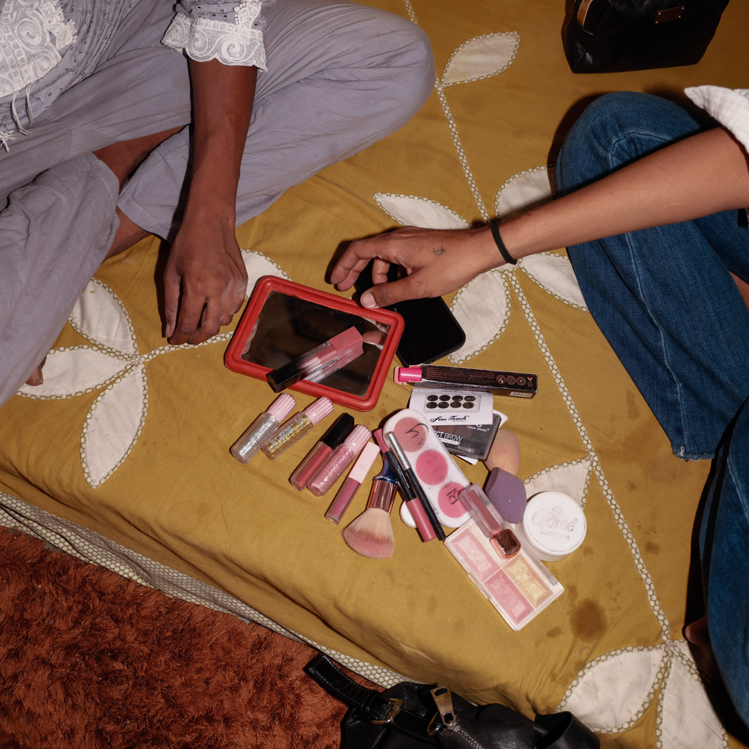 makeup products on bed